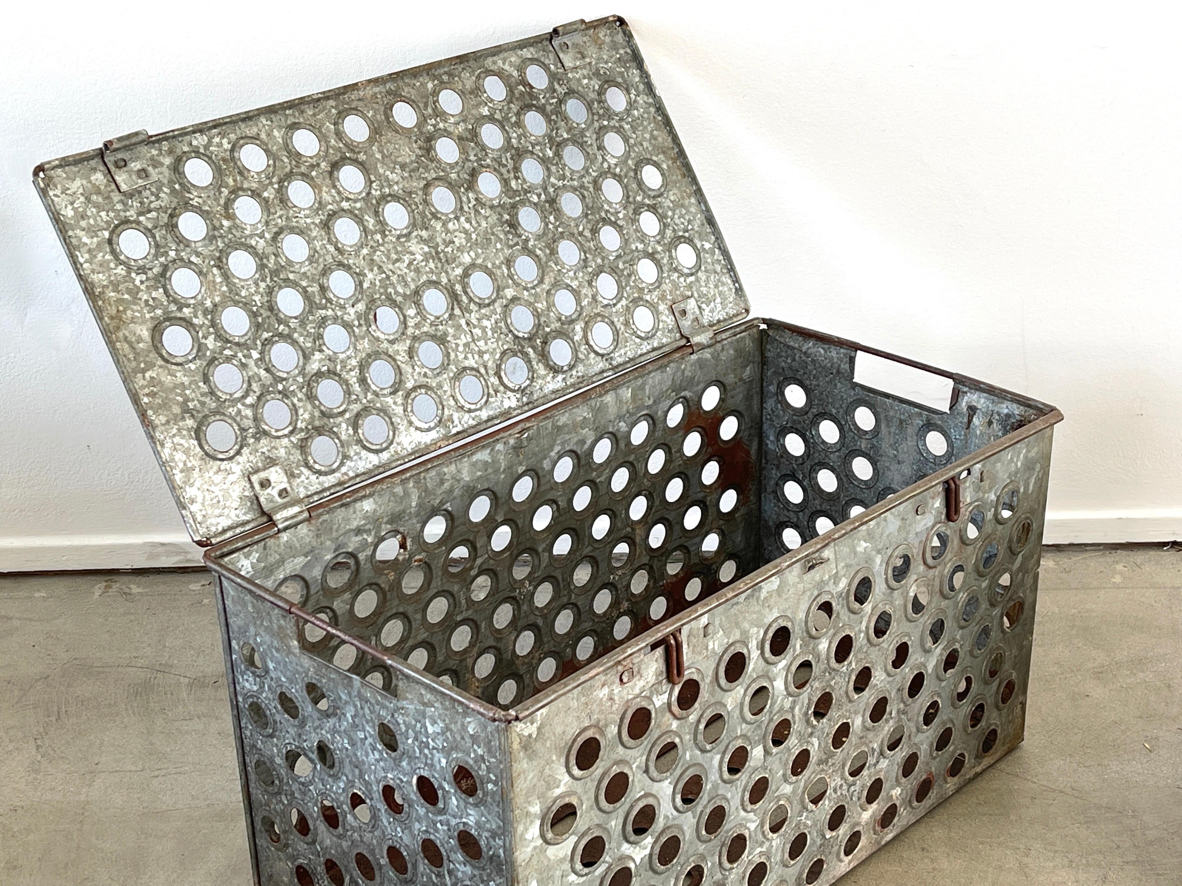 Industrial perforated metal boxes with fantastic patina 
Functional for records, toys or blankets
Fantastic design
Priced individually.