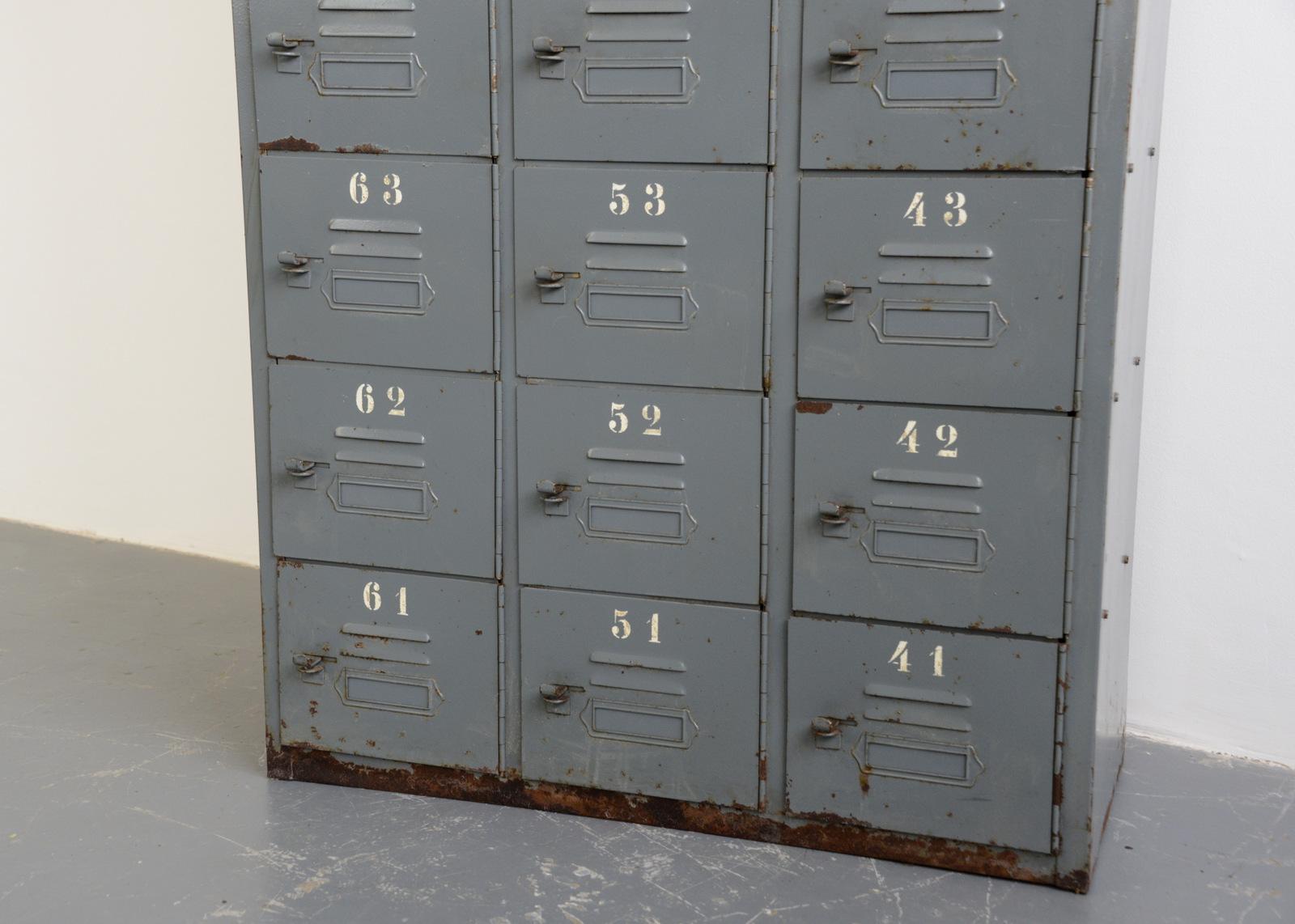 Industrial pigeon hole lockers, circa 1940s

- Made from steel with vented doors
- Cleaned and clear lacquered inside and out
- Original stenciled numbers
- German, 1940s
- Measures: 220cm tall x 40cm deep x 88cm wide

Condition