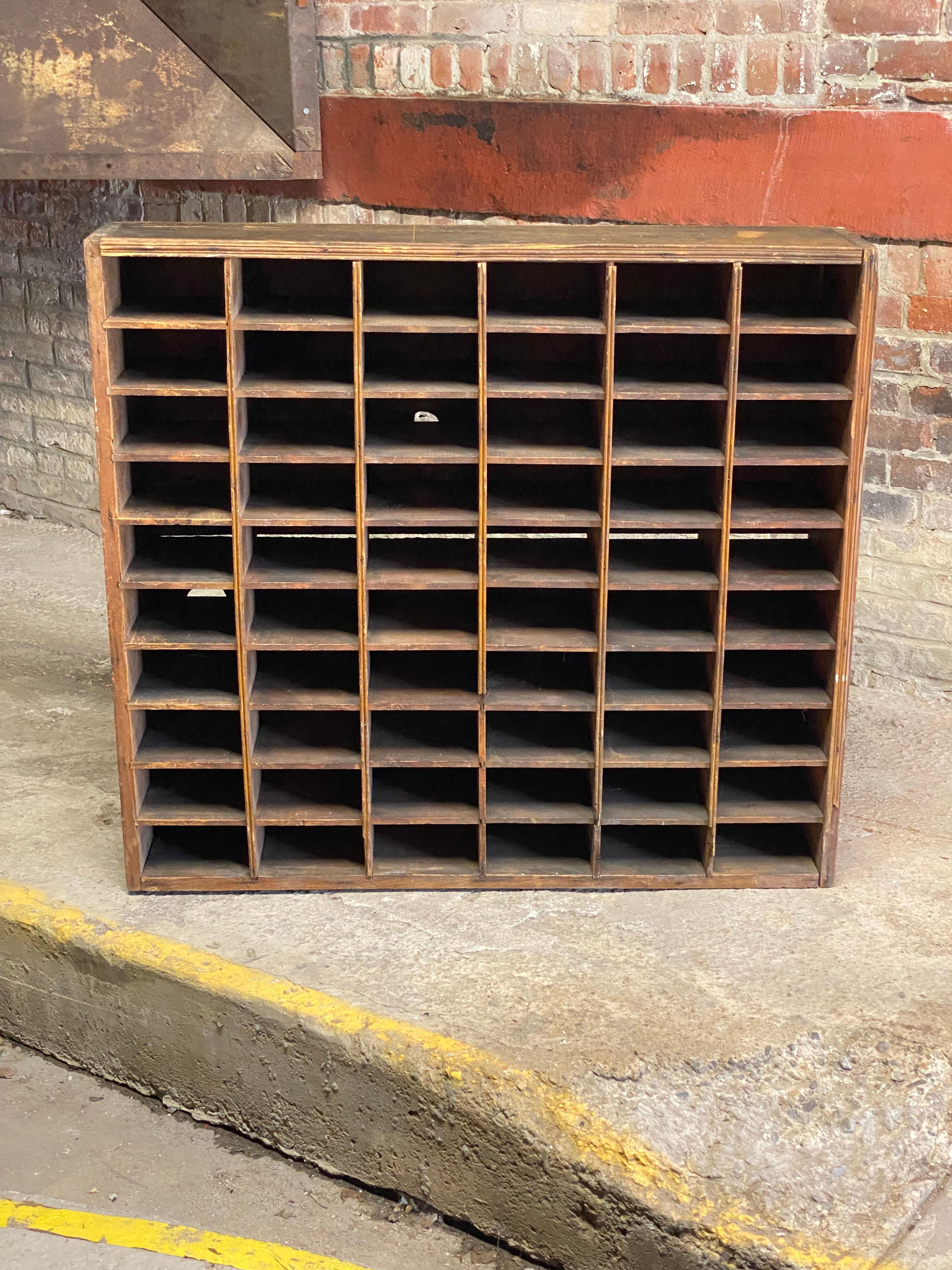 Sixty pine cubby hole slots. Multiple uses and possibilities for the home or business. Could possibly be used horizontally or vertically, but was initially used horizontally. 

Good durable condition. Nicely distressed due to use and weathering.