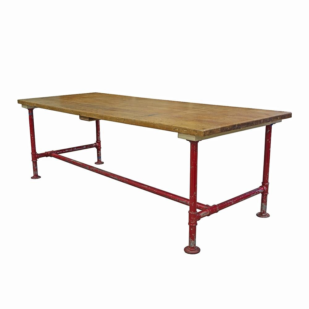 A great work height (35.25?) Industrial table with heft and substance, this pipe base table is painted cherry red for that extra pop. The solid maple block top will stand the test of time and toddlers, whichever comes first.