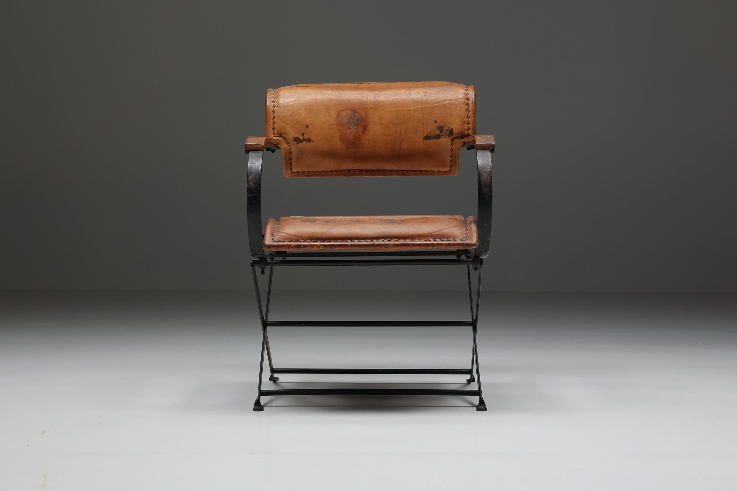 Industrial; armchair; Post-modern; leather; metal; Patina; 1990's

Postmodern armchair with remarkable patina. The black painted metal structure has a very industrial feeling to it. The leather seating and arm and backrest are a very comfortable