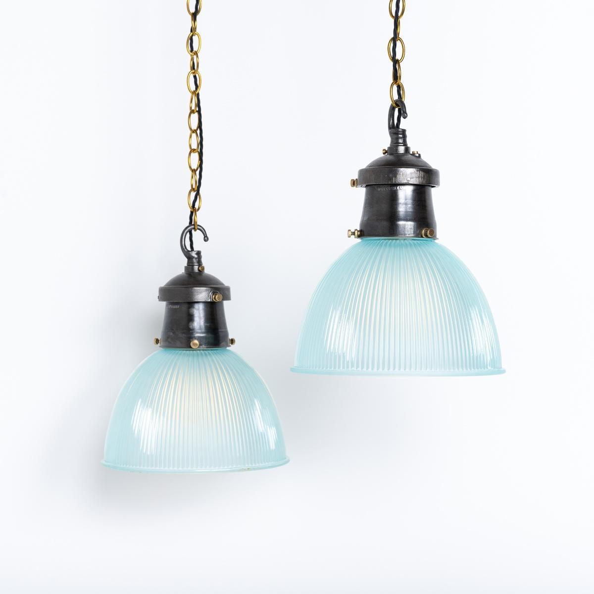 BLUE TINTED HOLOPHANE PRISMATIC FACTORY LIGHTS

Rare and stunning blue Holophane prismatic glass shades with industrial cast iron fittings and brass holding screws.

Reclaimed from an old industrial mill these shades were made in England circa
