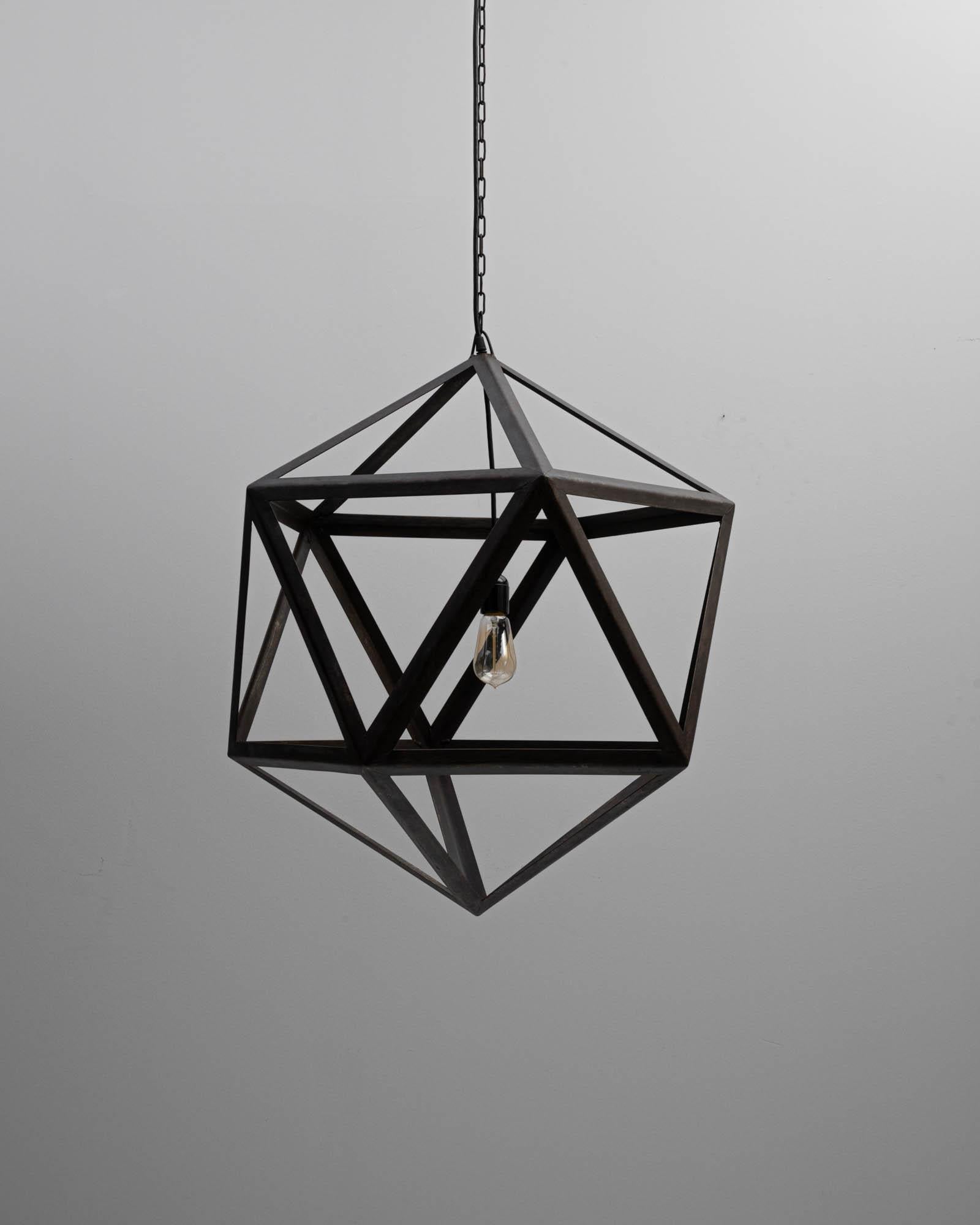 A prototype created in our atelier, this platonic pendent is created entirely from welded steel angle rods. The star-like icosahedron design of this lamp creates a pleasing network of geometric shadows, which gleam on the walls around it. Industrial