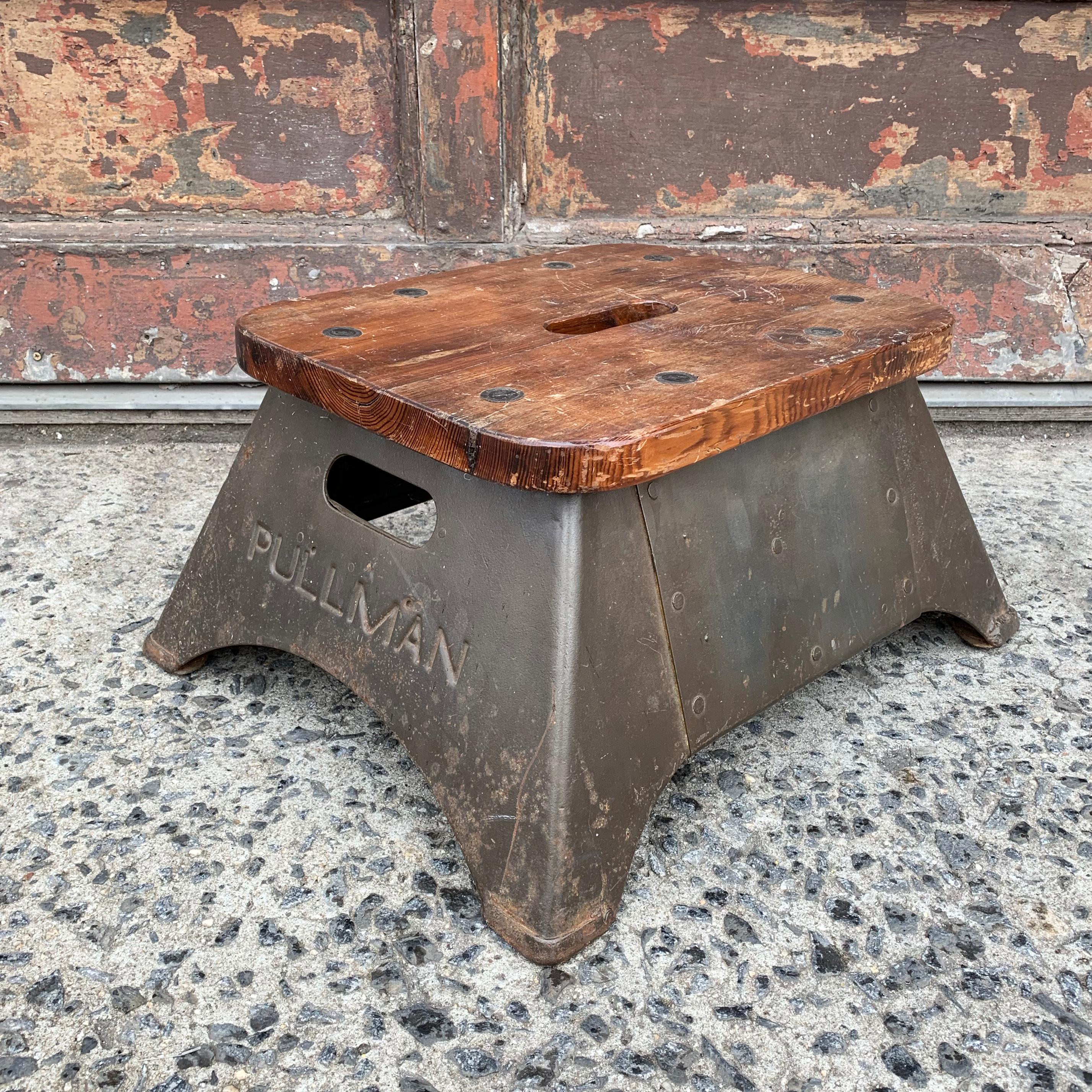 Industrial, midcentury, Pullman, train conductor, step stool with oak top and steel base. Top measures 17 x 13.5 inches.