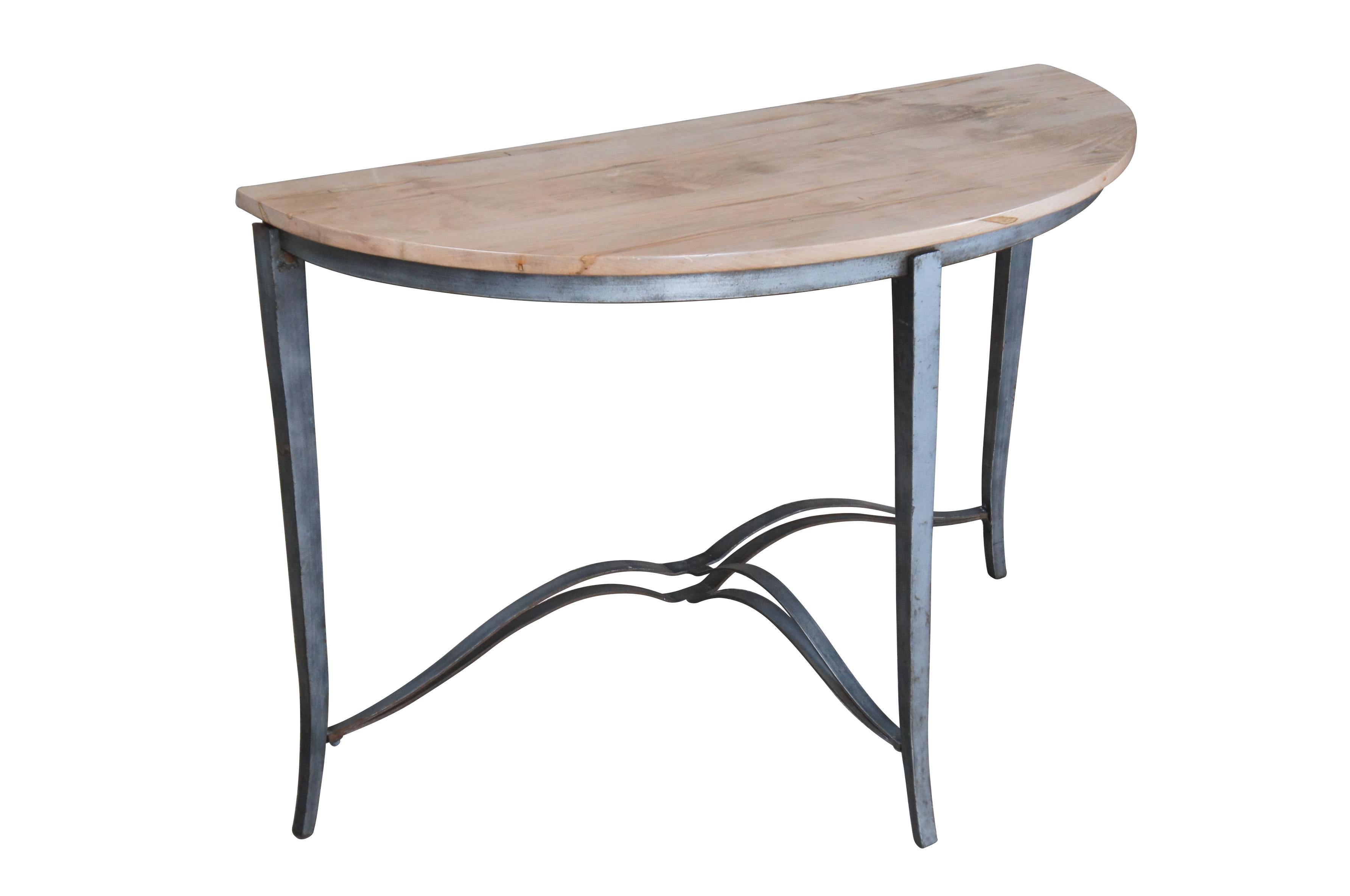 Half Moon maple console table with industrial reclaimed iron base, circa second half 20th century.  Features tapered legs connected by a serpentine support.  Great for in an entry hall or living space.

Dimensions:
19.5