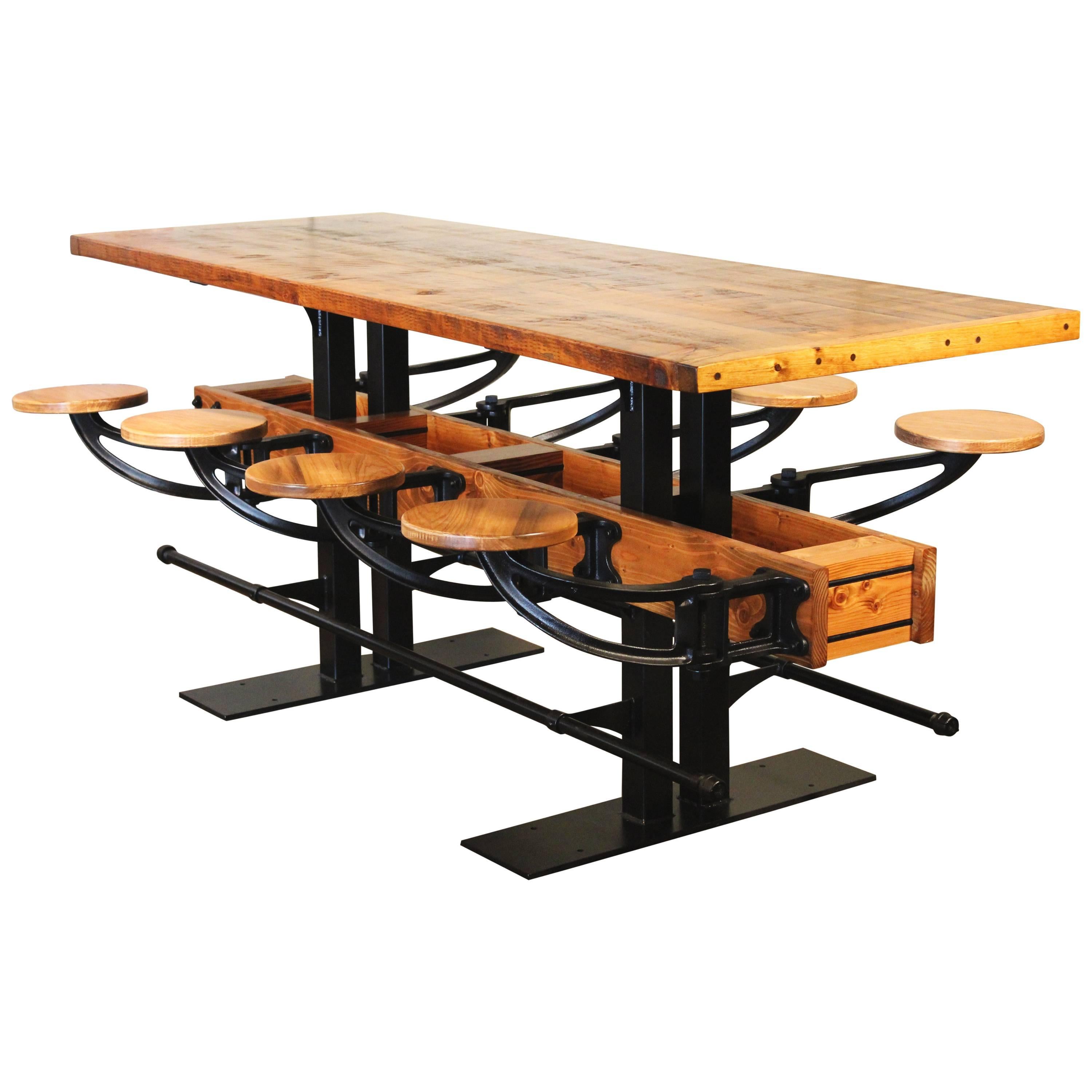 Swing out seat restaurant bar / pub height table. Featuring eight cast iron and wood swing out seats, foot rails and 2