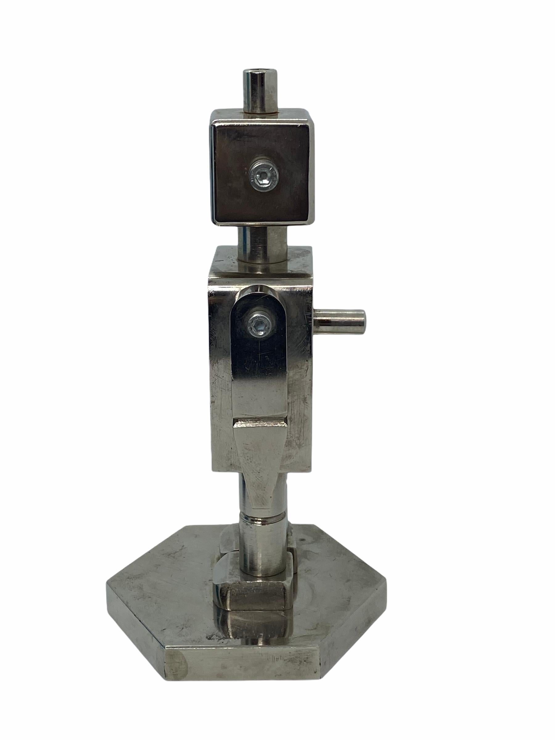 An Industrial robot made in the 1970s. This unique object was traditionally an exercise given to a novice machinist to test their knowledge and skill at operating their machine. It requires careful calculation, setup and precision operation to