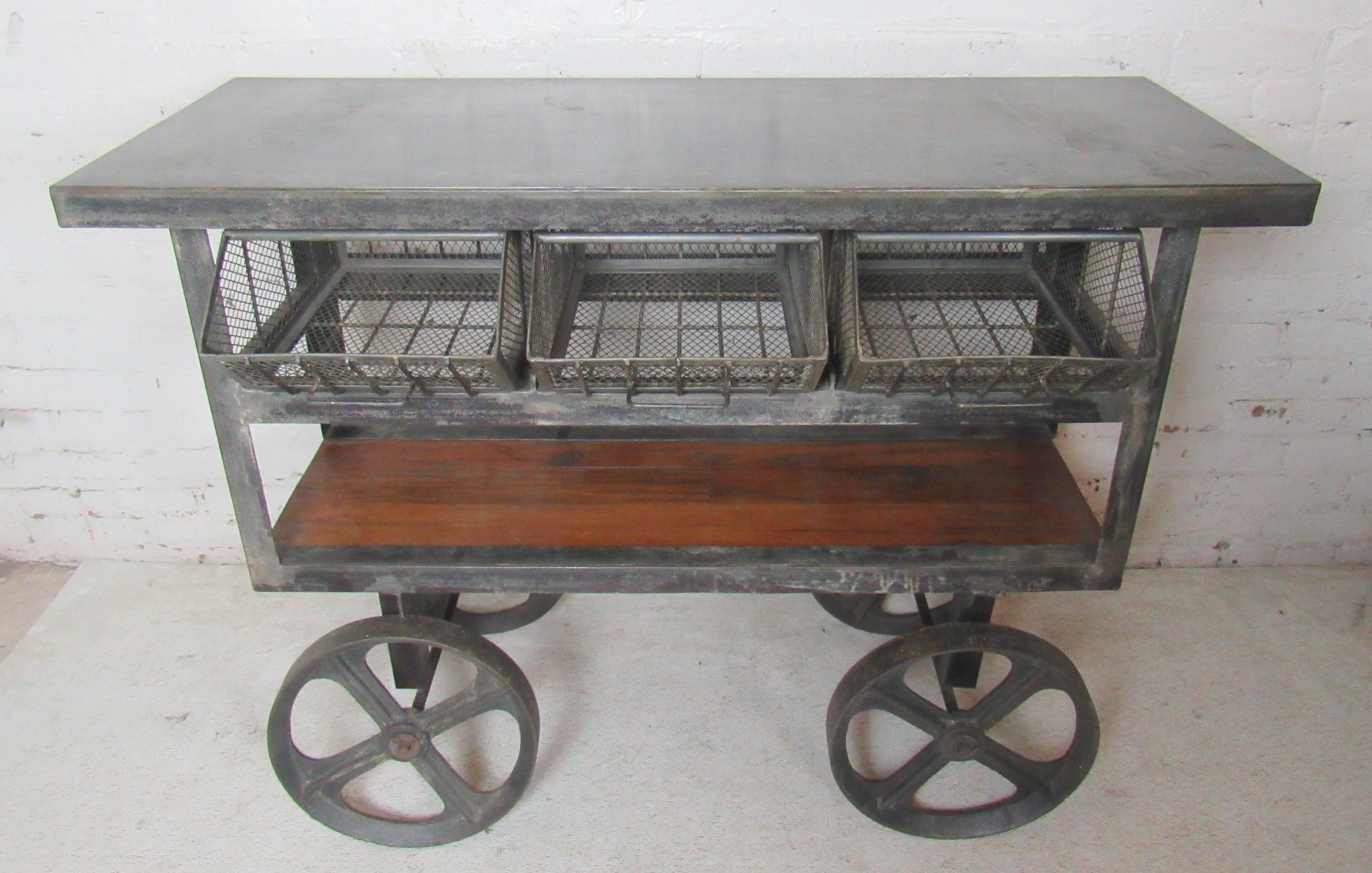 Industrial style cart for modern home use in kitchen or living room. Metal top, iron frame and wood shelving.
(Please confirm item location - NY or NJ - with dealer).
 