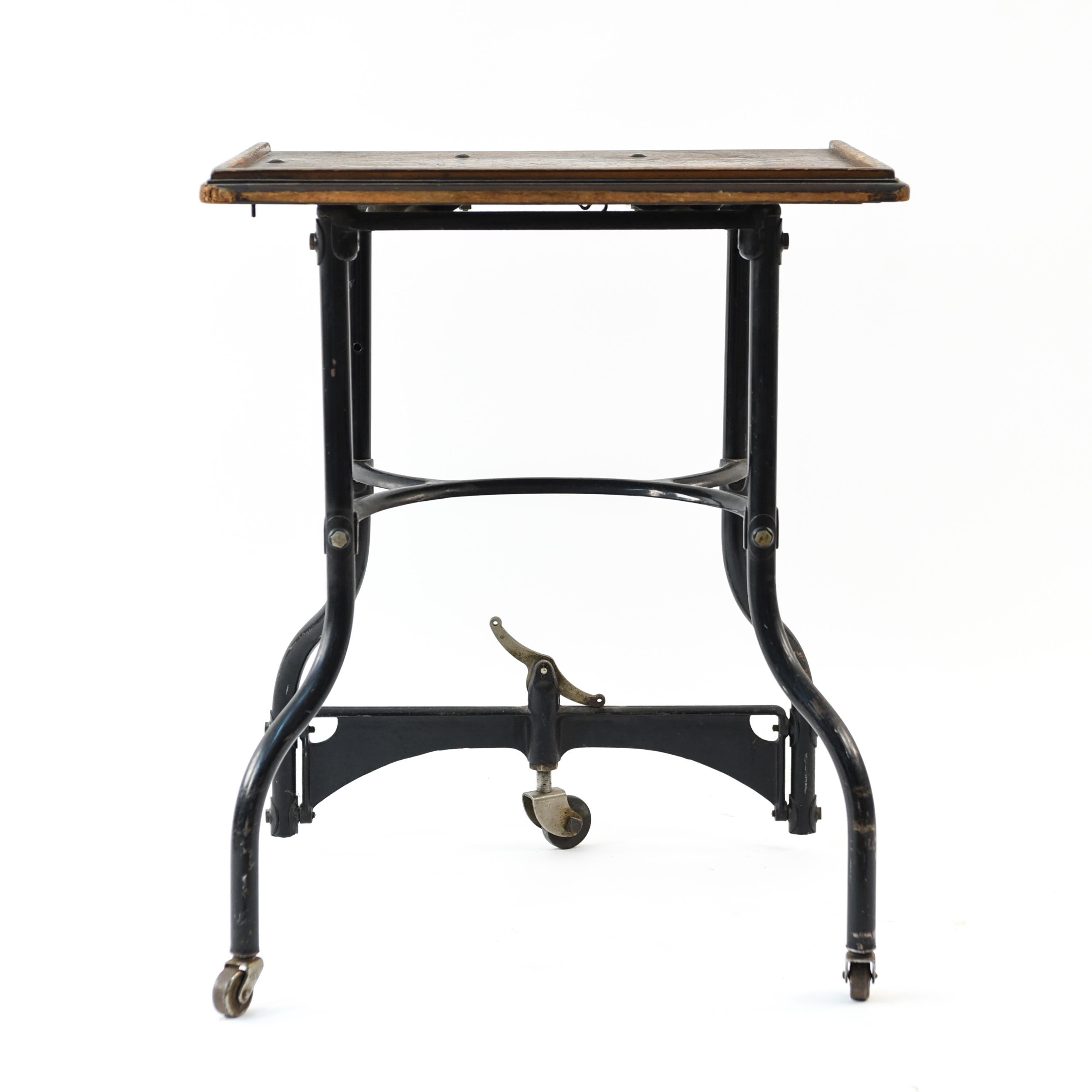 This petite rolling side table brings an industrial element into a living space. With adjustable legs allowing the piece to be slightly lowered and raised depending on desire to roll or stabilize.