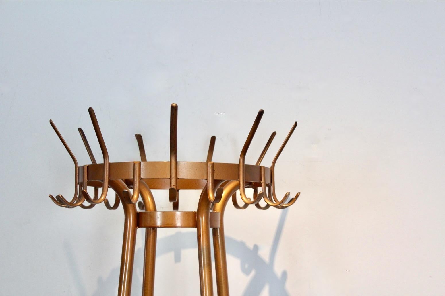 Wonderful Industrial round Hall stand, Coat Rack made of steel in the 1960’s. There is quite a lot of place for coats, shawls and hats. It has 26 coat pegs and in the middle also place for umbrellas and walking sticks. The coat stand is in good