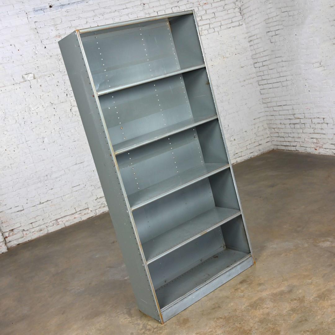 Incredible Mid to Late 20th Century Industrial Rustic distressed metal shelving, bookcase, or display unit. Beautiful condition, keeping in mind that this is vintage and not new so will have signs of use and wear even if it has been refinished or
