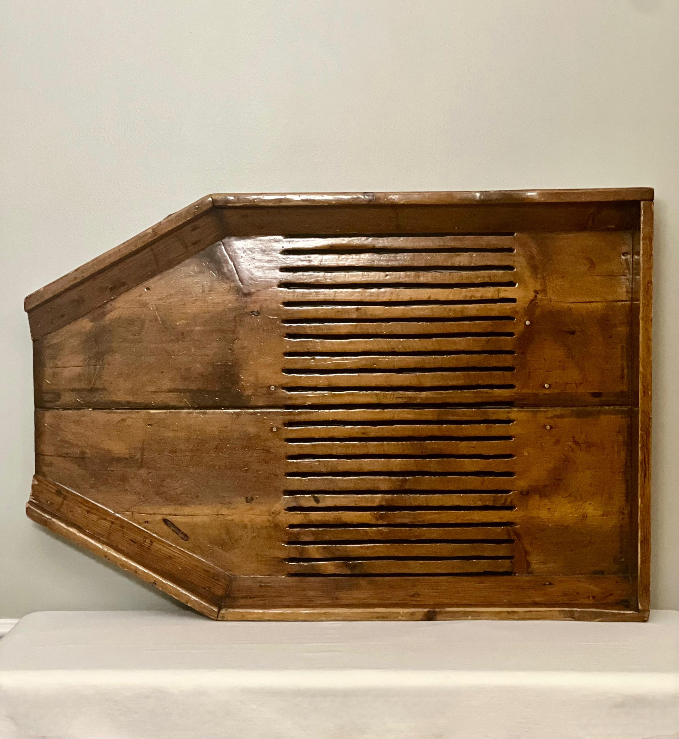 Unique industrial salvage large cranberry bog harvesting board, early 20th century. In the past, cranberries were harvested by hand and often involved the use of handcrafted tools and manual techniques. This large wood board features
