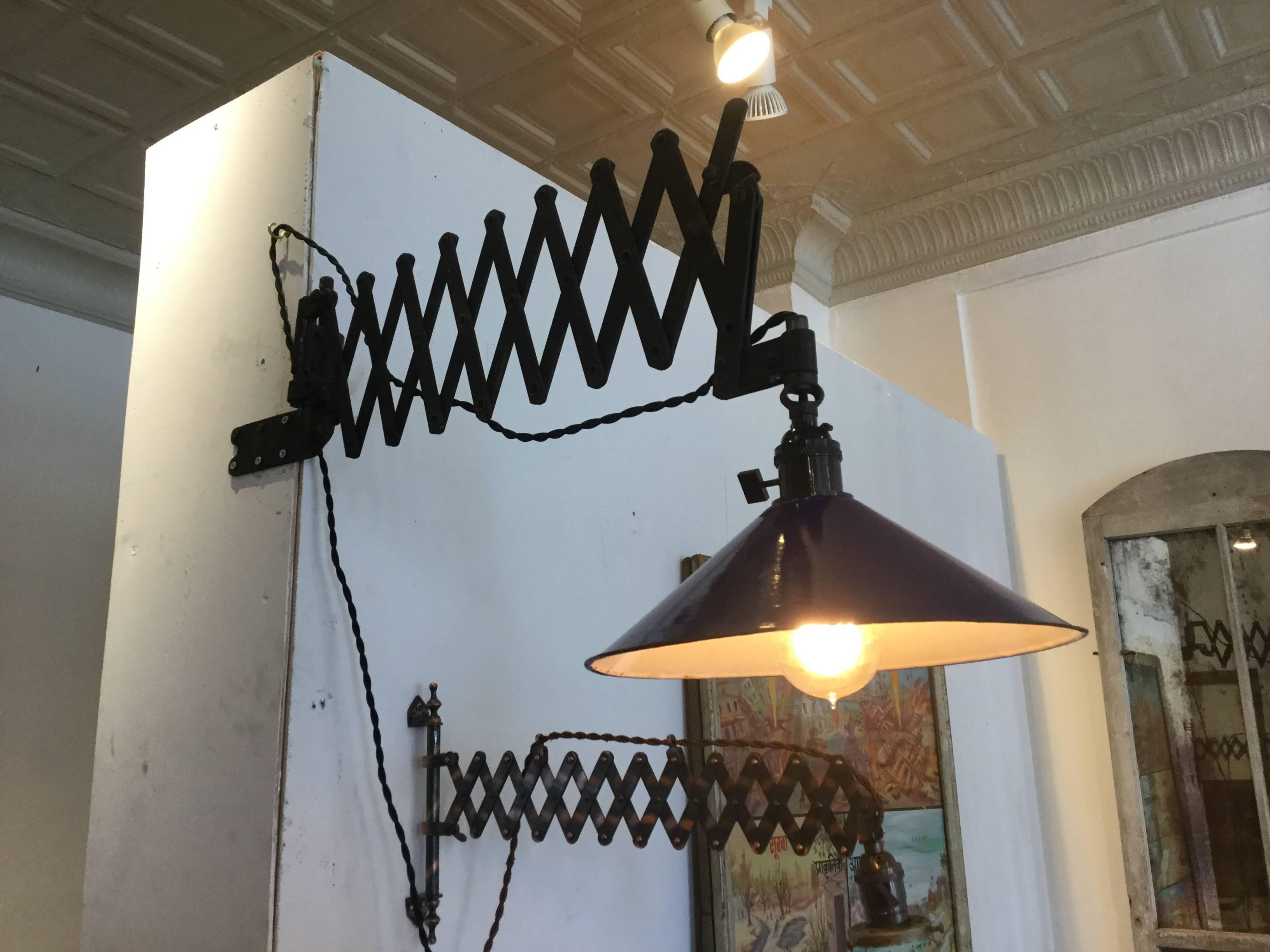 Original Industrial Scissor or accordion lamp, circa 1910. This has a blue enamel shade. The arm retracts and swivels.