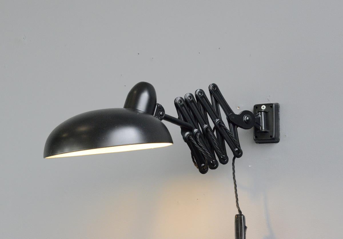 Industrial scissor lamp by Escolux, circa 1930s

- Extendable scissor mechanism
- Takes E27 fitting bulbs
- On/Off switch on the cable
- Made by Schroder & Co. under the Brand name 