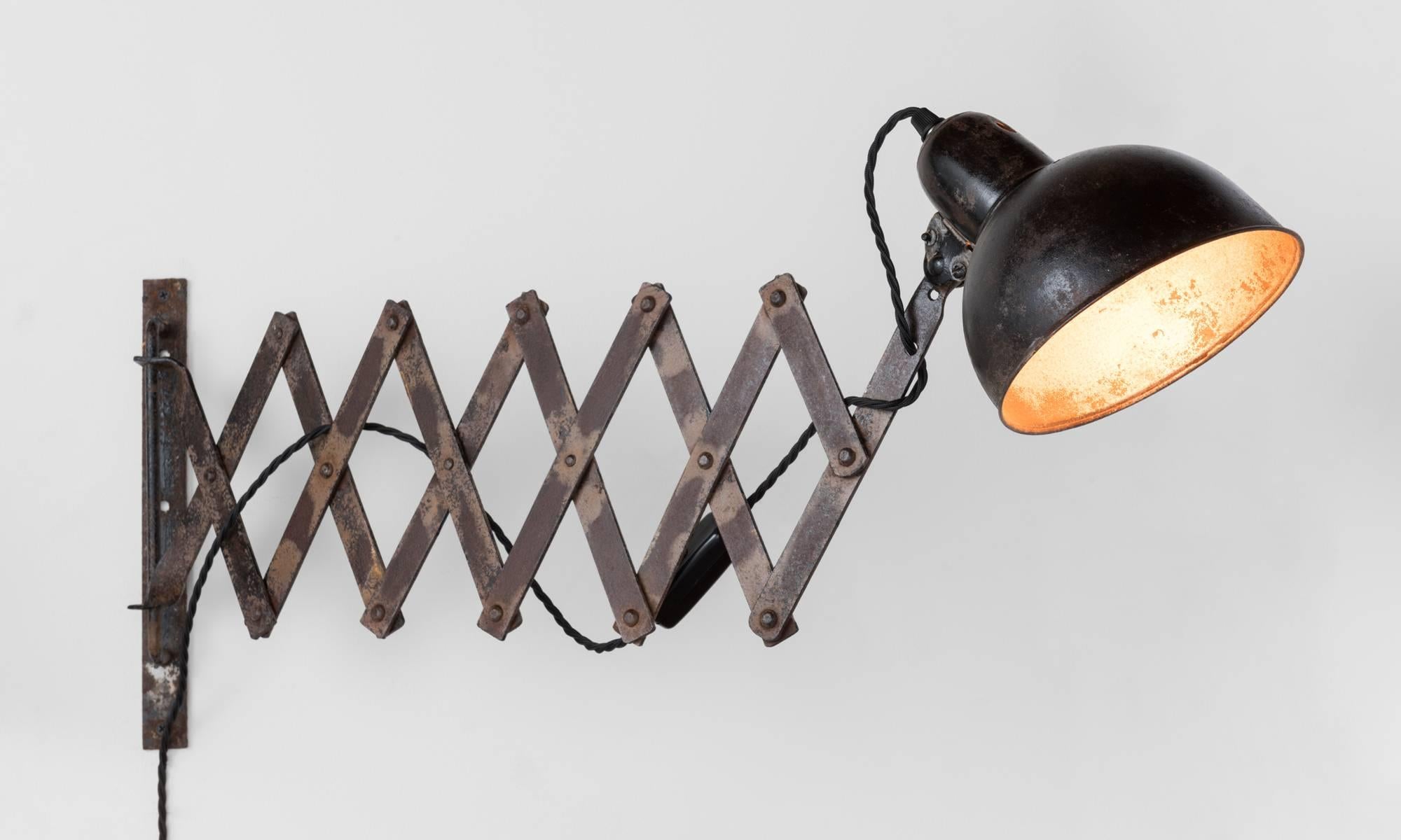 Industrial Scissor lamp by Kaiser Idell, circa 1930.

Early model by Kaiser Idell with wonderful patina.

Lamp extends 16