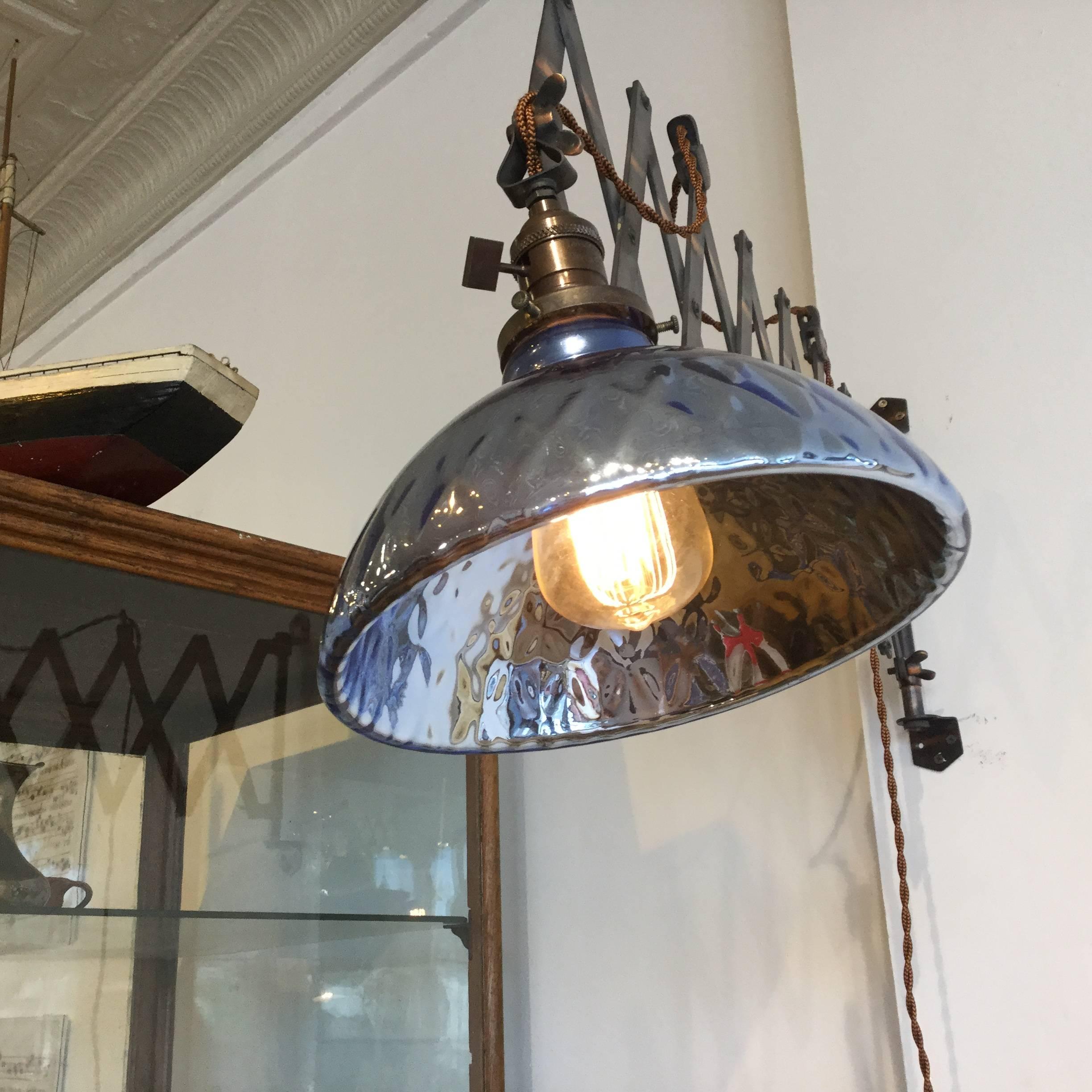 Large blue mercury glass shade on japanned scissor arm. The blue and the copper and beautiful together. Rare.