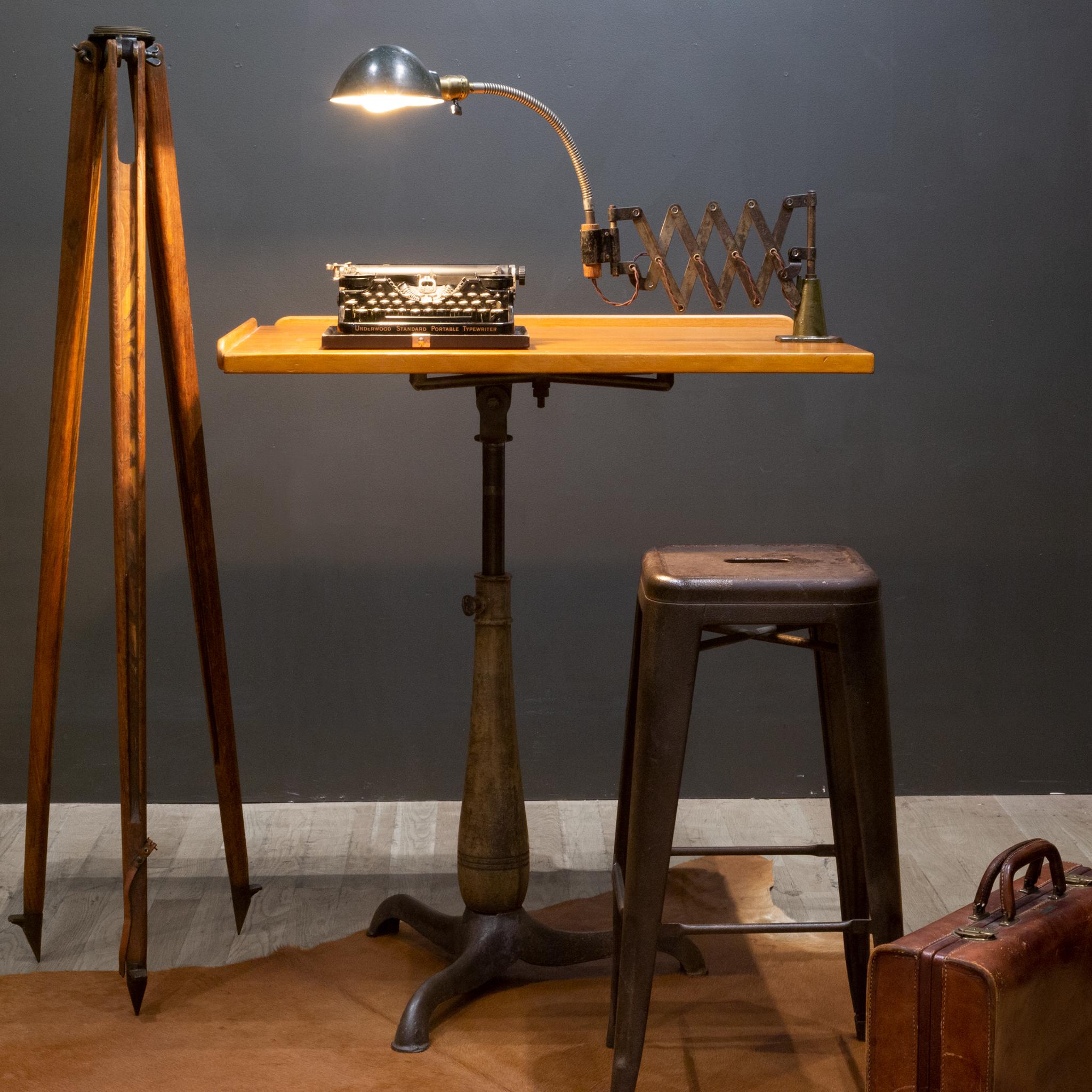 About

An industrial table mount scissor task lamp with metal shades, cast iron base, original fabric cord and articulating arm. Fully adjustable, the shade tilts and the arm can extend fully. This piece has retained its original finish and works