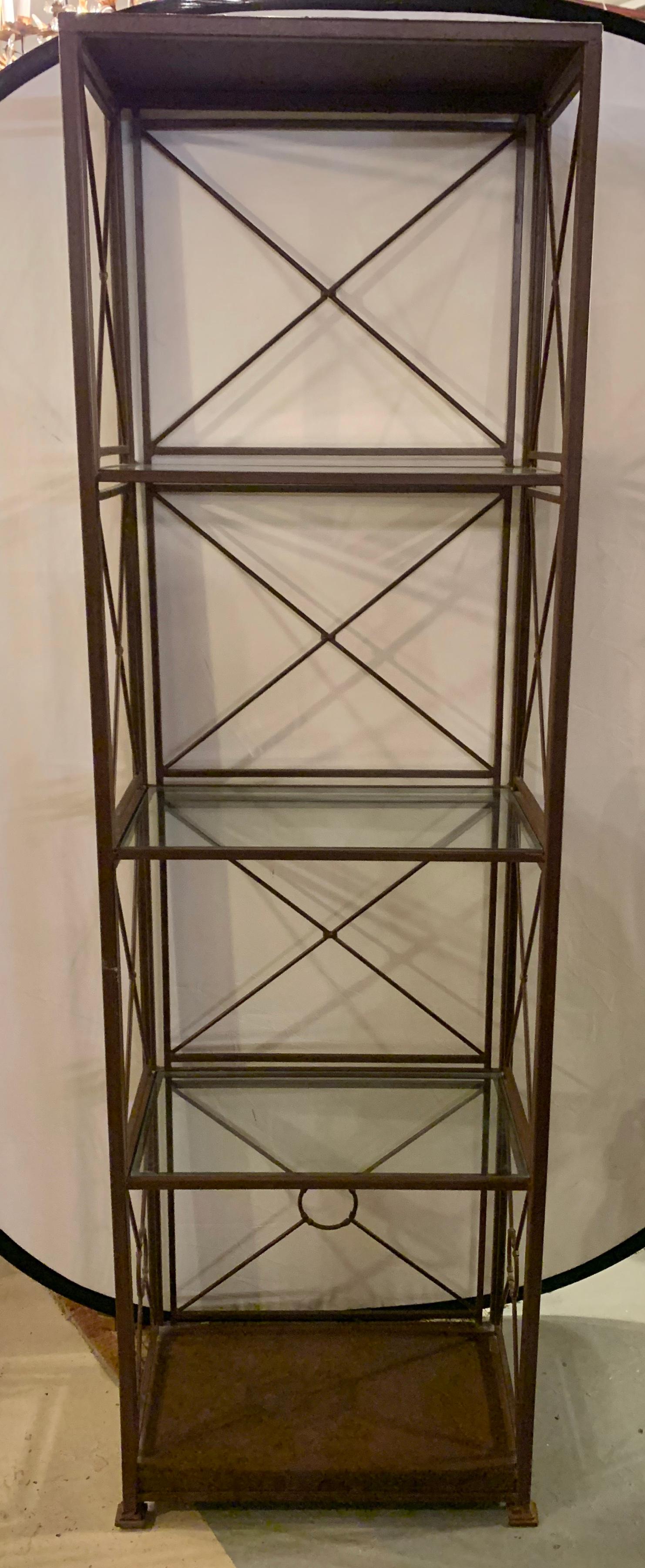 Industrial shelf Unit or Étagère. Tall and impressive having five shelve three of glass form with X decorated back and sides.