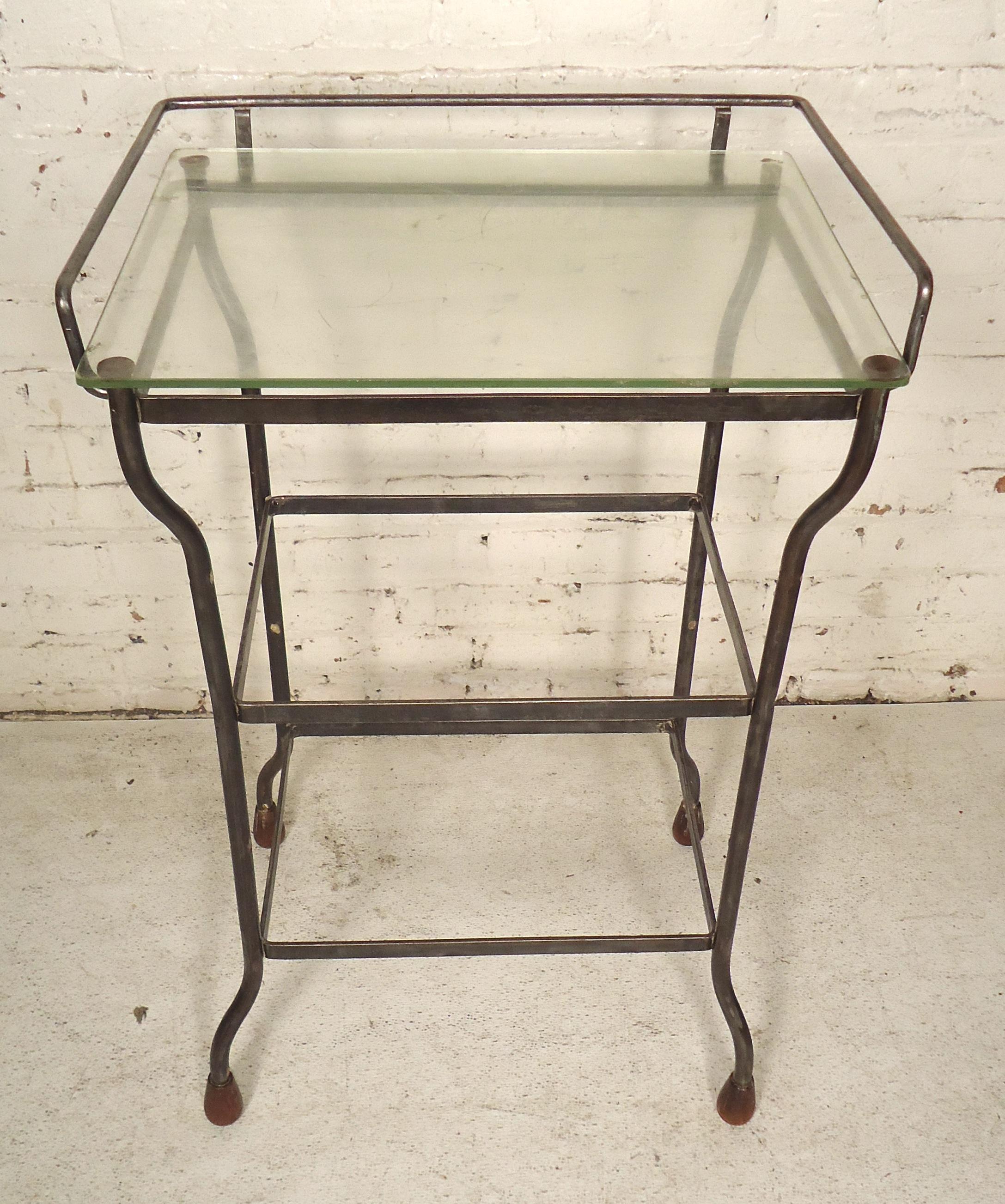 Metal table with glass top. Refinished in a bare metal style finish.

(Please confirm item location - NY or NJ - with dealer)
     