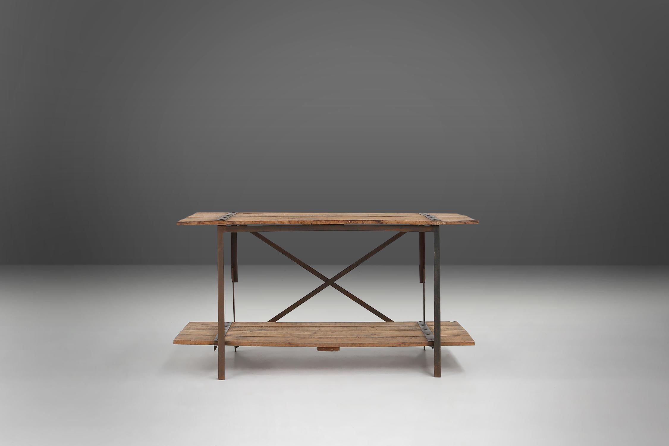 Belgium / 1920 /  2 side tables / wood and metal / industrial

Two sturdy industrial side or work tables with tough metal details on the wooden top, made in Belgium around 1920. These versatile tables have a removable platform similar to the top on