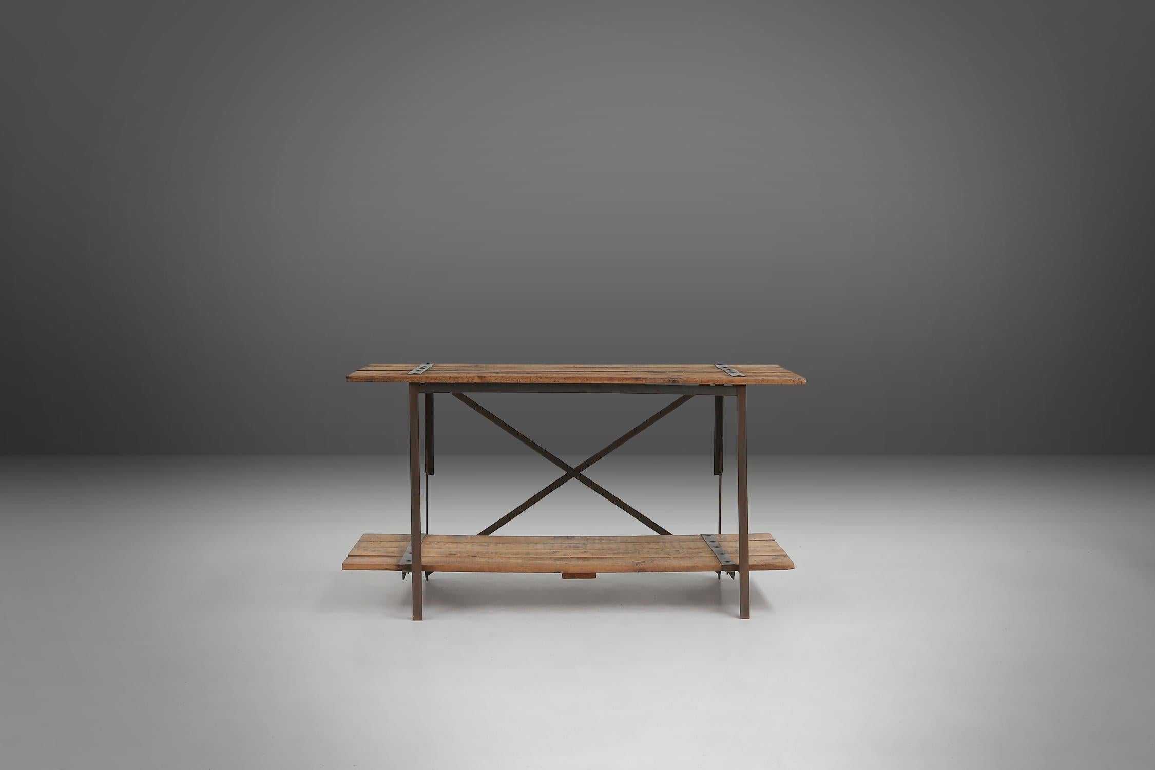 Belgium / 1920 /  2 side tables / wood and metal / industrial

Two sturdy industrial side or work tables with tough metal details on the wooden top, made in Belgium around 1920. These versatile tables have a removable platform similar to the top on