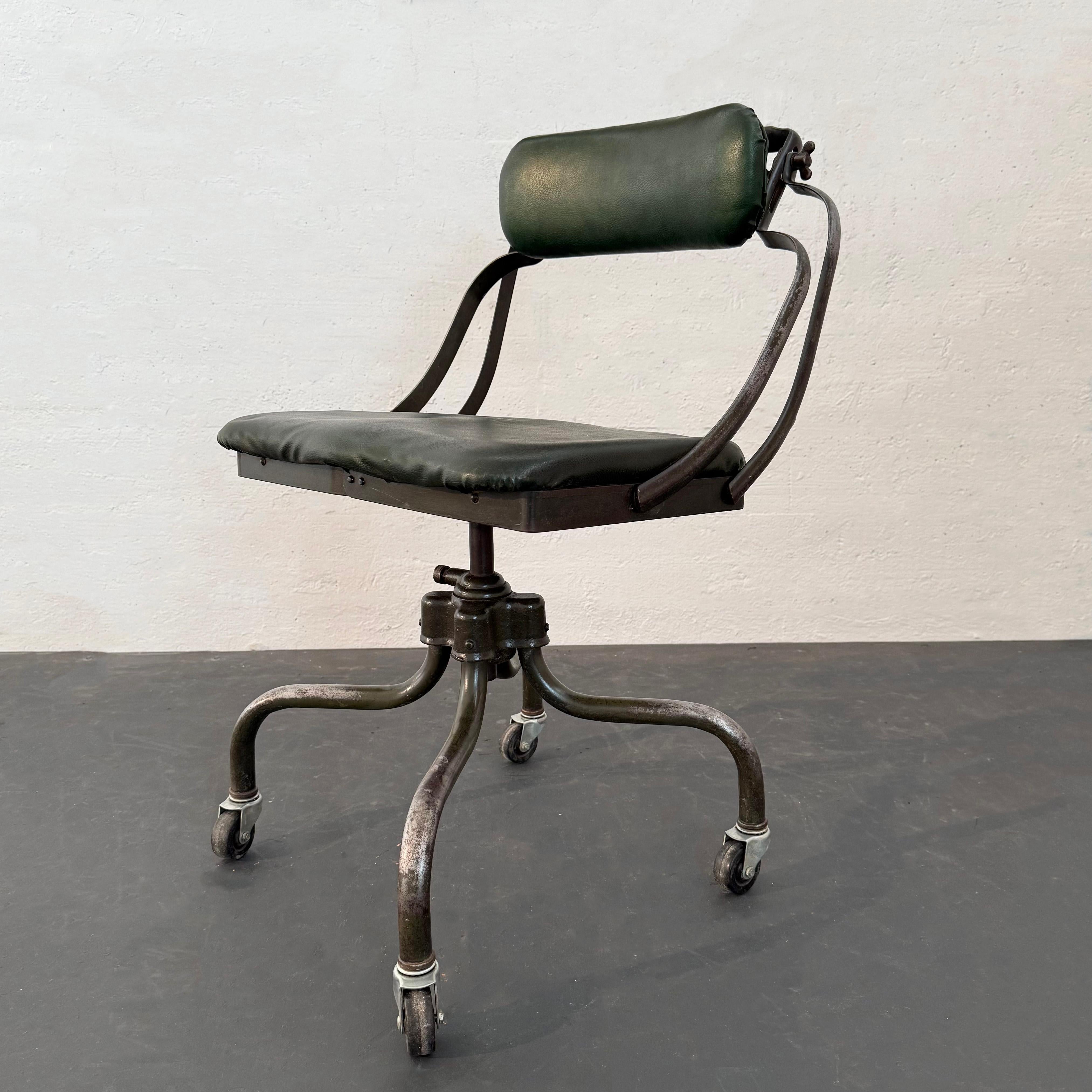 This vintage industrial office task chair was manufactured as a stenographer's chair by the office supply and typewriter company Remington Rand. The chair model is called the 