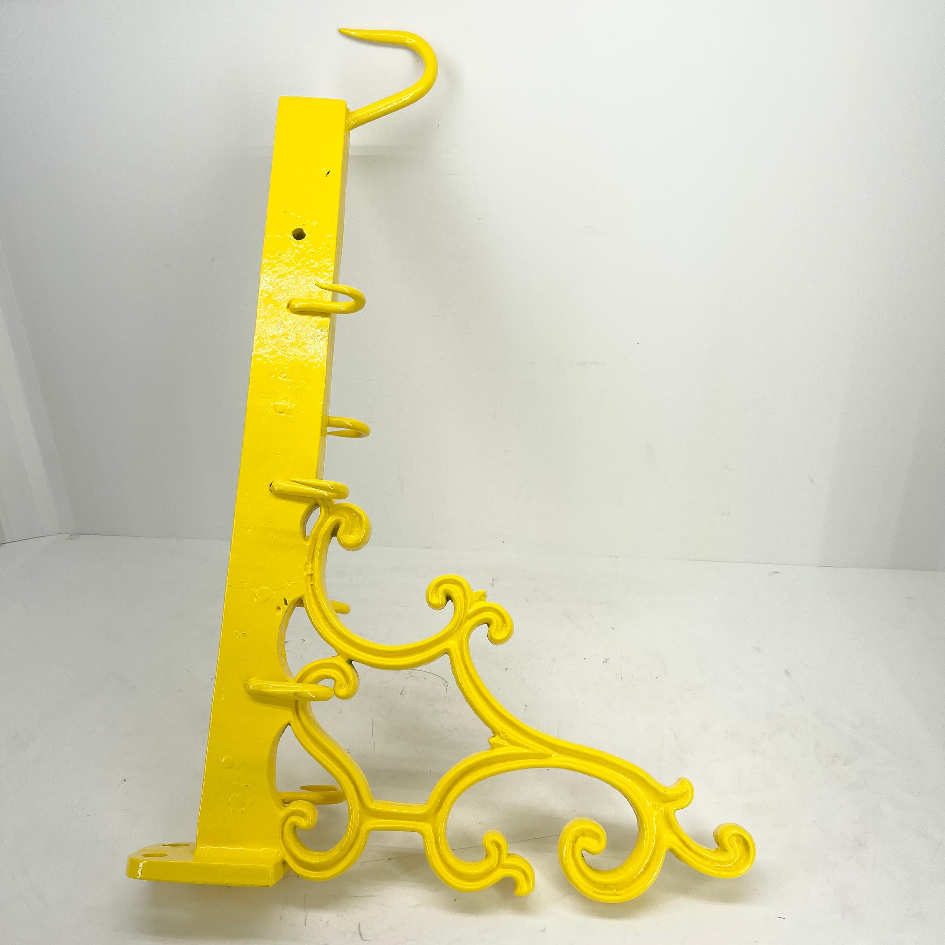 Large and bold this large industrial era meat hook has been freshly powder coated in bright sunshine yellow. Feast your eyes on this bold statement collectible piece! Hanging in the kitchen or actually in any room, this meat hook is as functional as
