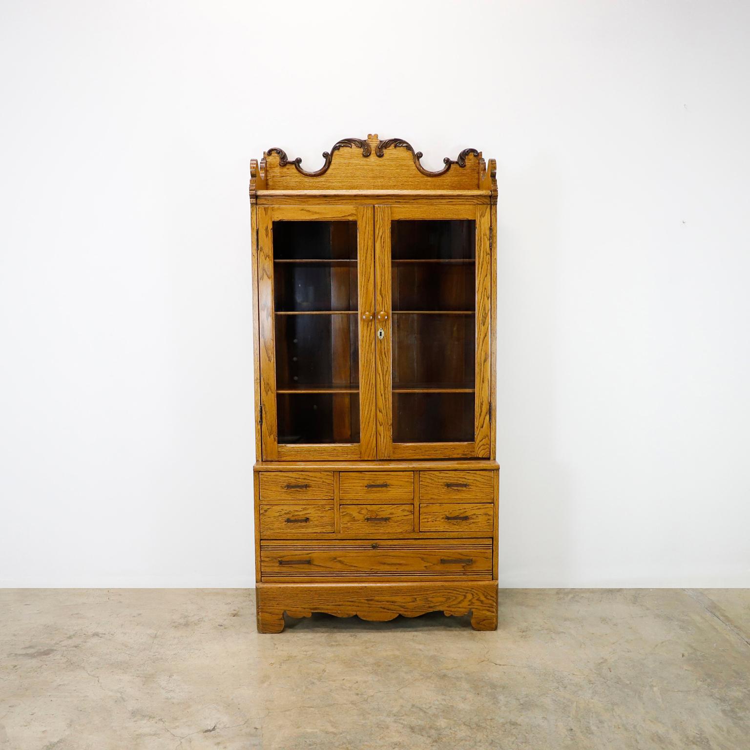 Circa 1940. We offer this Industrial Solid Oak Library Bookcase with Drawers. 
Recently professionally restored