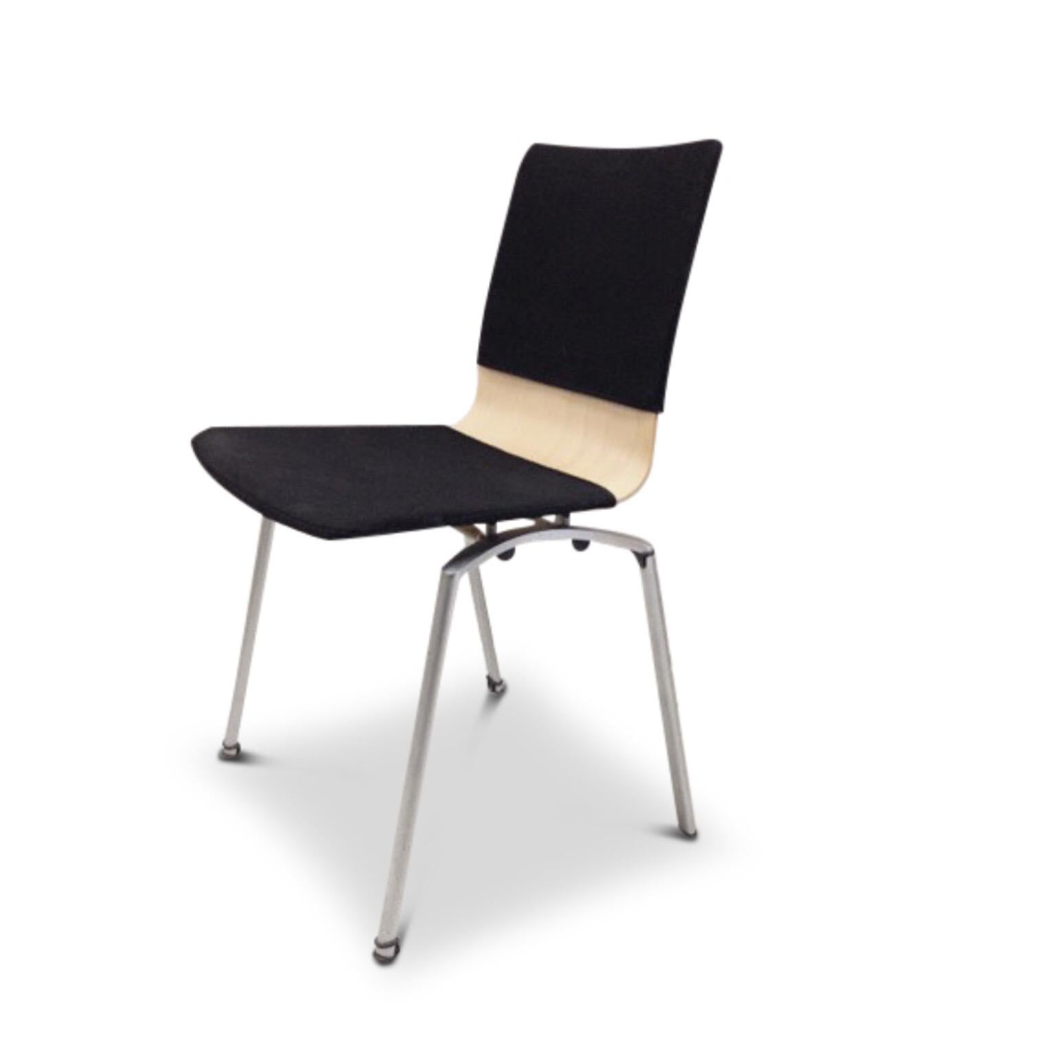 This Industrial Congress chair was designed by Krijn Hamelink for CAR Katwijk during the 1960s. The chair features metal legs and plywood base, upholstered in black fabric. The fabric can be removed for cleaning purposes. The chair remains in a good