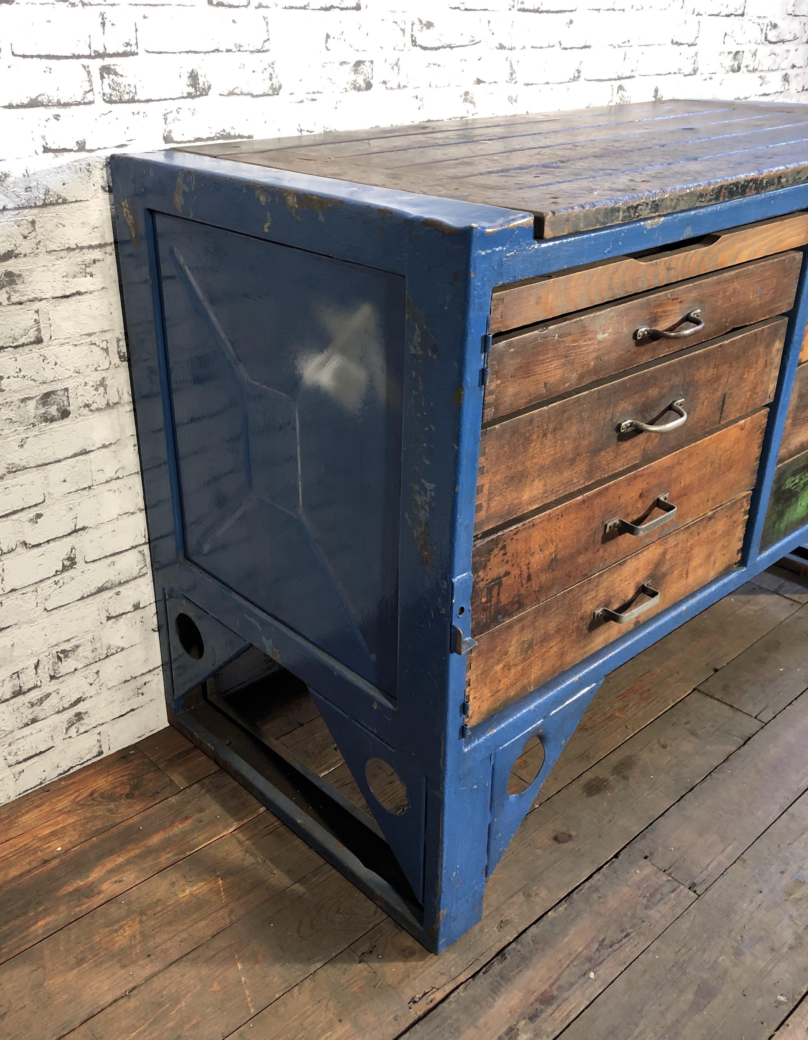 This Industrial chest of drawers features a steel frame with multi wood drawers. Eight drawers have different heights. The chest of drawers is in a good vintage condition with a nice blue patina. It weights 86 kg.
Drawer dimensions: Width 58cm,