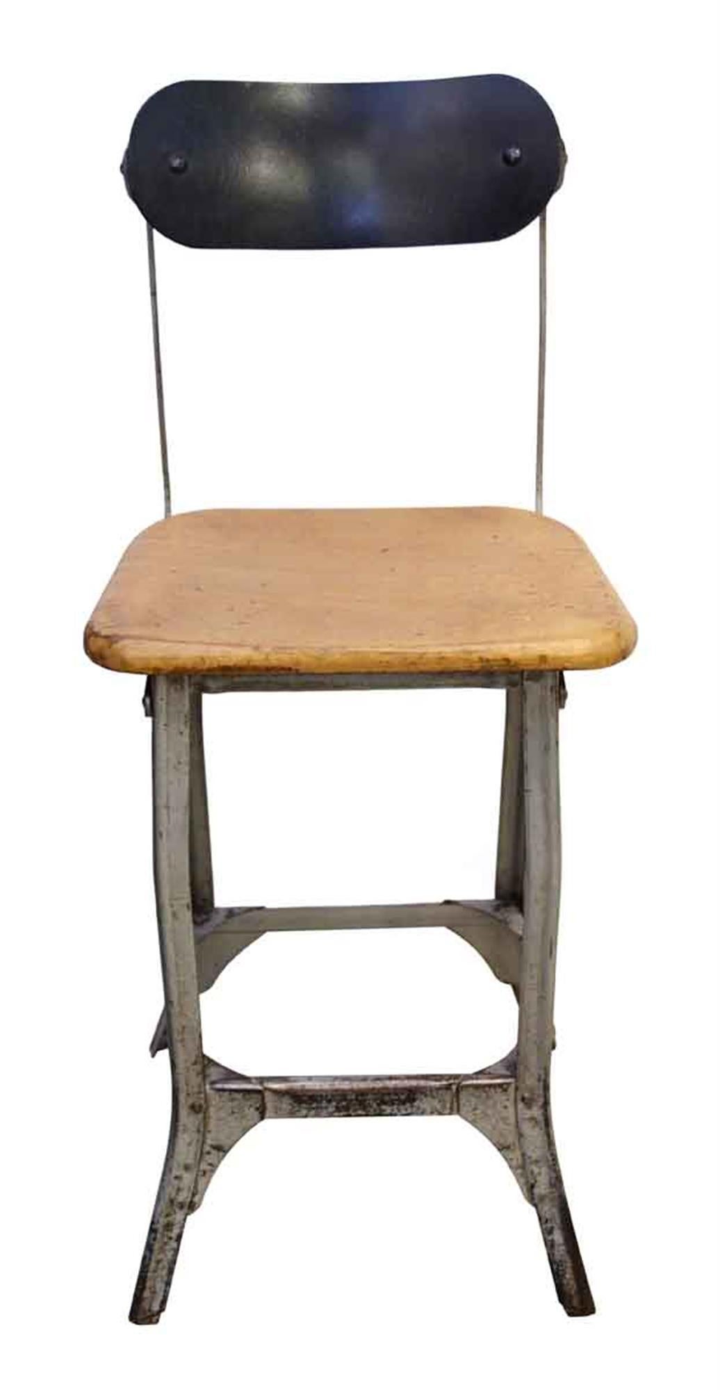 1940s stool with a light wood tone seat and refinished metal back. This has charm and durability! This can be seen at our 5 East 16th St location on Union Square in Manhattan.