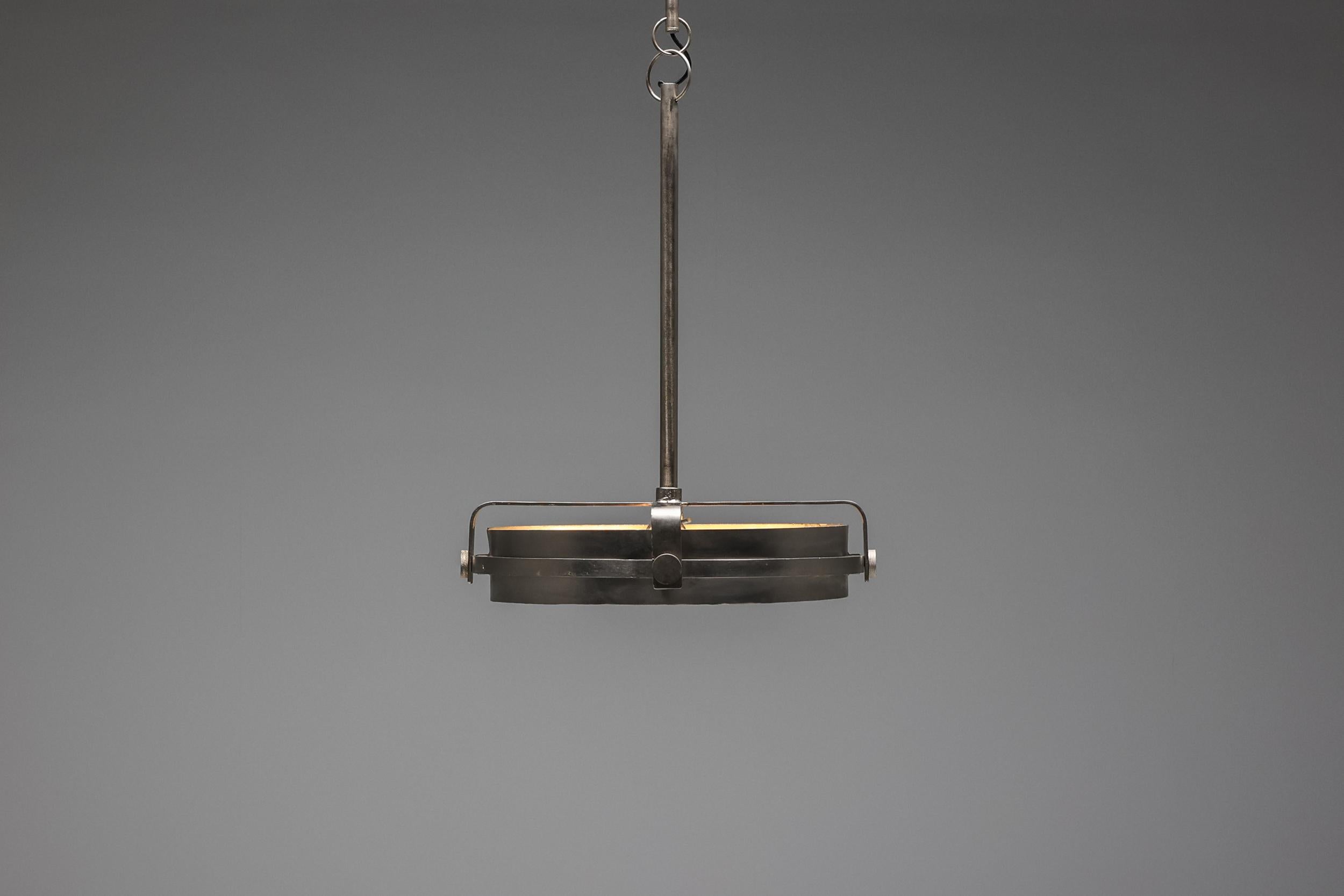 French design, Industrial, Post-modern, chandelier, pendant, 1990's.

Industrial steel ceiling lamp made in the 1990s in France. A very elegant piece with remarkable details. It has the ideal luminance to place above a dining table or area that is