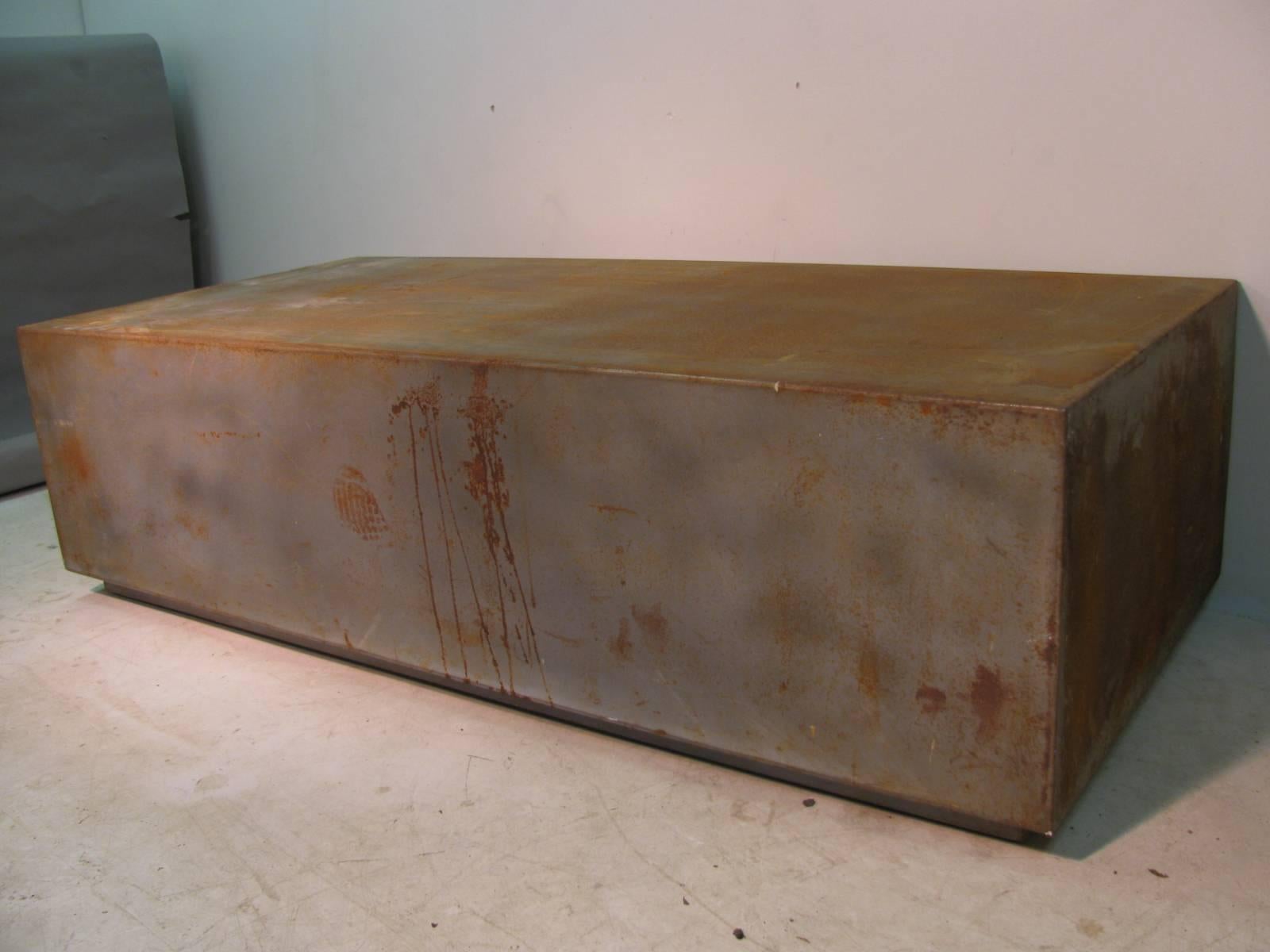 Welded steel cocktail table on wheels. Surface rust has been waxed.