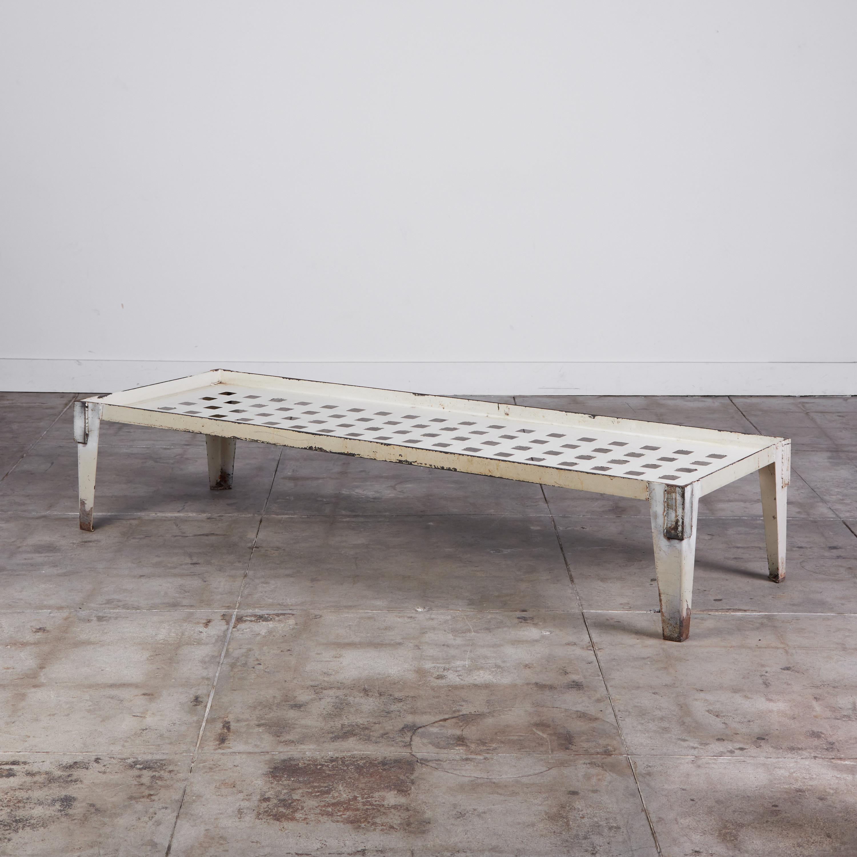 Industrial steel daybed frame. The bed has been perfectly patinated due to age and wear. Suitable for both indoor and outdoor use. The daybed IS offered without a cushion. Please reach for custom cushion pricing options. Cushions can be made COM or