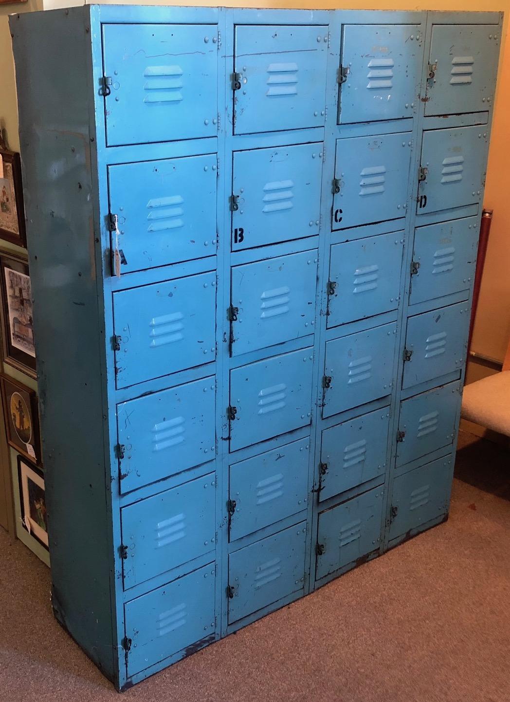 Industrial steel locker set, mid-century.  In striking, original robin's egg blue color with 24 cubbies and pulls that can be padlocked. Industrial strength with some rust and minor paint chips. Good to go in hallway, kids' room, rec room, kitchen,