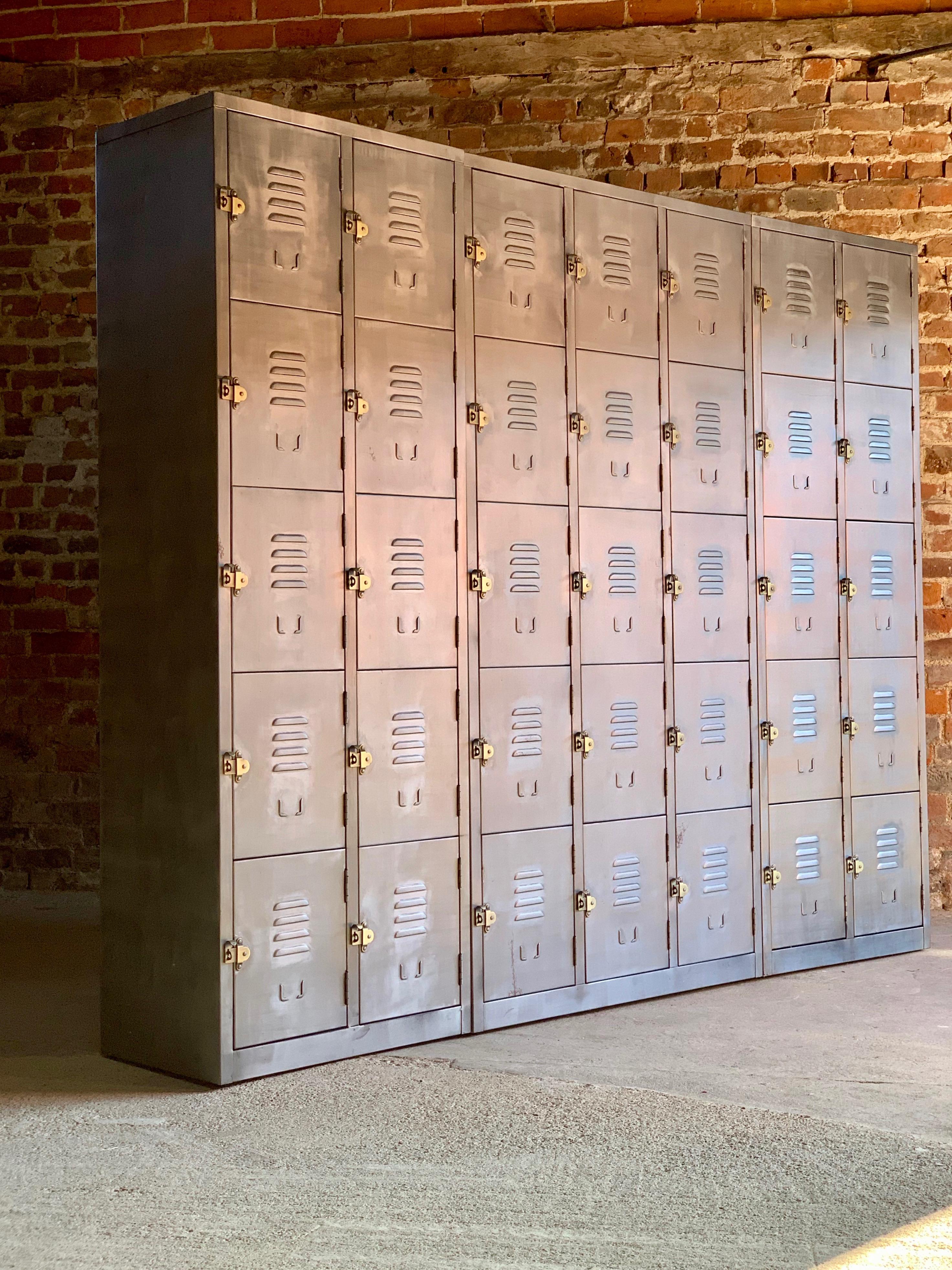 Magnificent Industrial steel lockers by Timothy Oulton loft style American School lockers

Fabulous set of Timothy Oulton industrial steel lockers comprising of one set of 15 lockers and two x sets of 10 lockers (total 35 cabinets)  Industrial