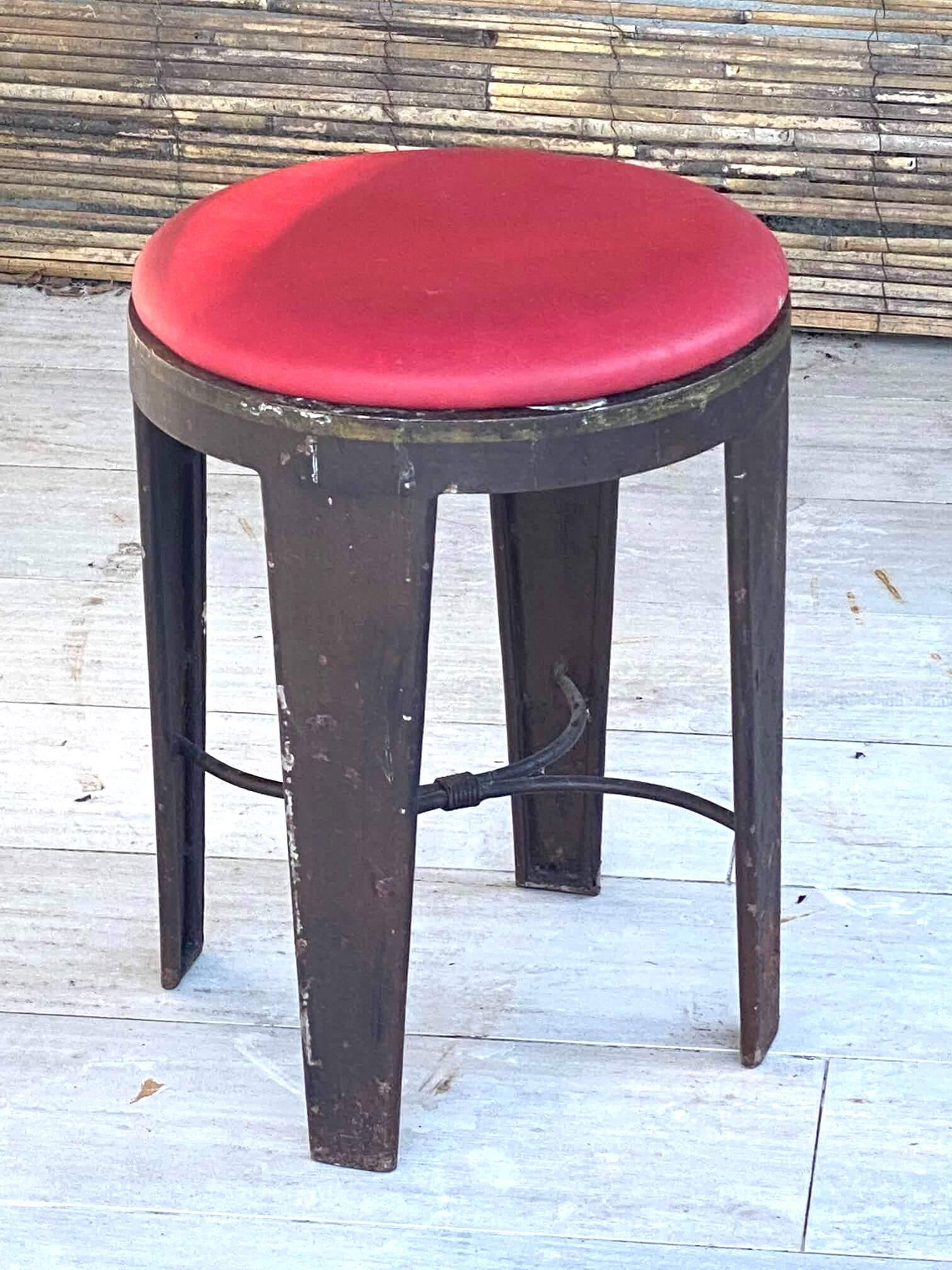 This stool, is in iron, it is very heavy. The seat is in faux leather. It has been made in France in the 1950s. Perfect into a loft spirit atmosphere.