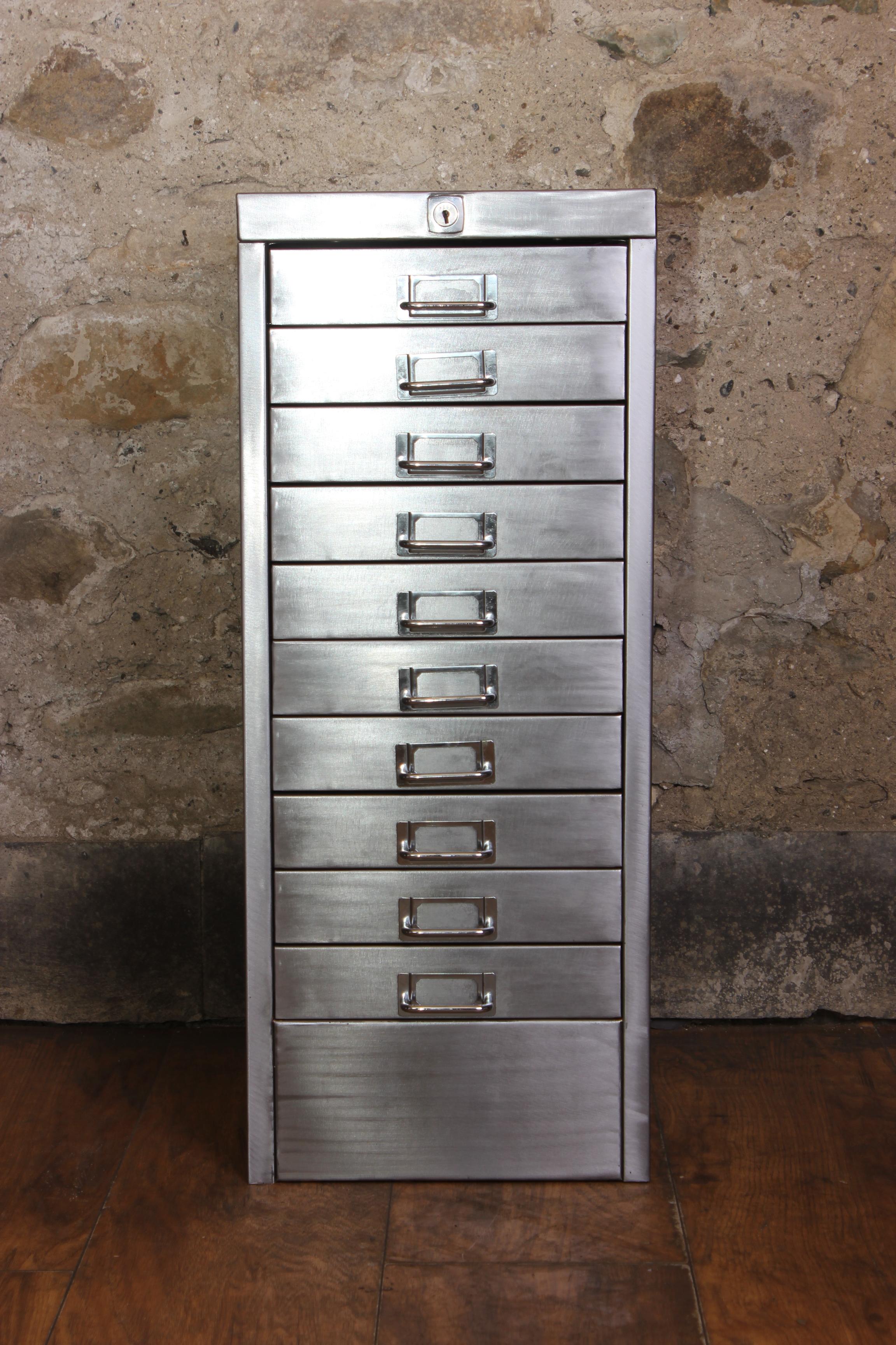A stunning 1980s Industrial stripped metal 10-drawer filing cabinet. This impressive A4/Letter size Industrial Design piece has been stripped back to bare metal and was manufactured in the United Kingdom. All the drawers run smoothly and have label