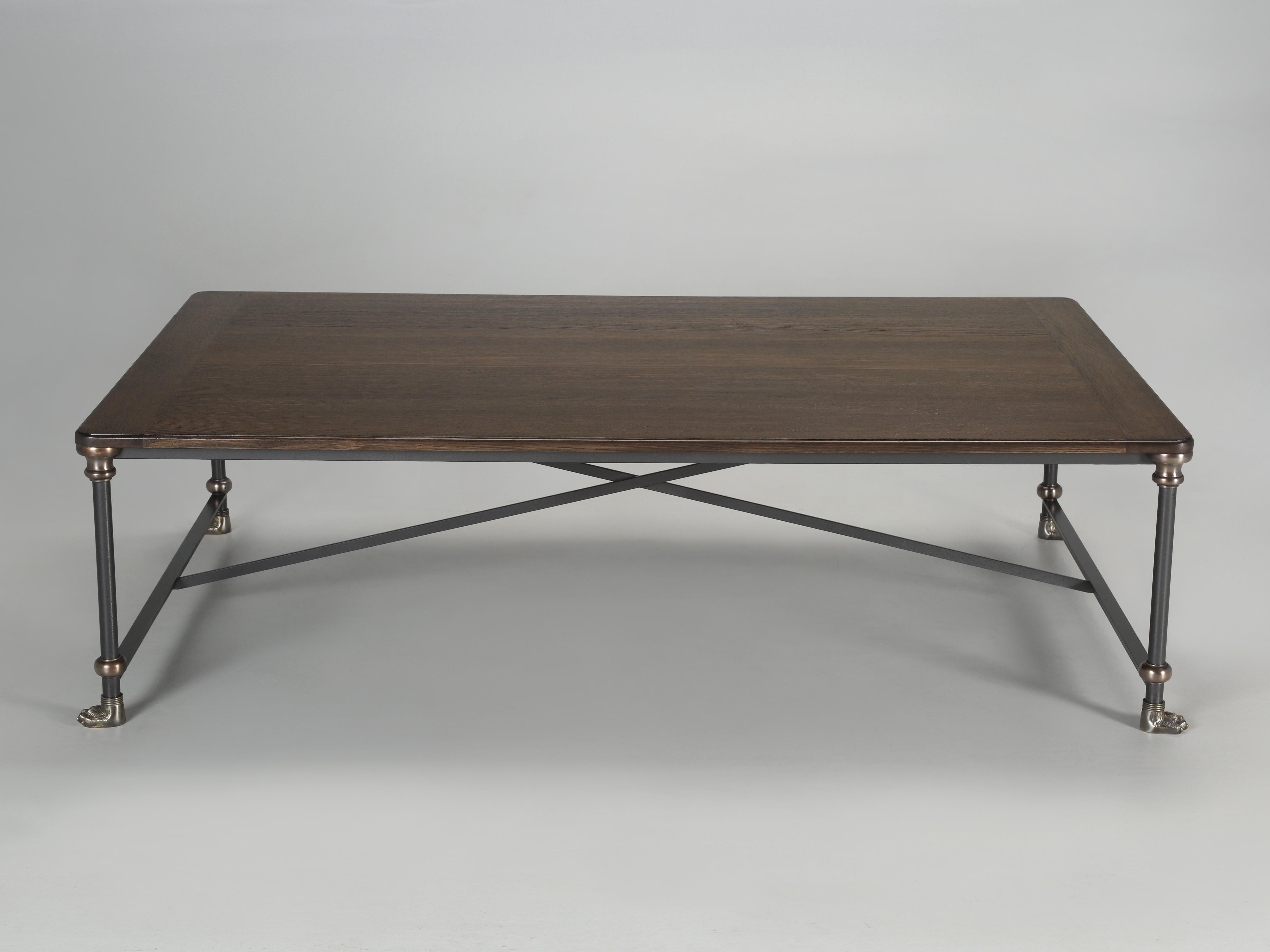 Coffee table hand-made in Chicago to your specifications and virtually any dimension or finish is possible. Our Industrial style coffee table is made with a rift-cut white oak top with bread-board ends, steel hammertone finished frame, solid bronze
