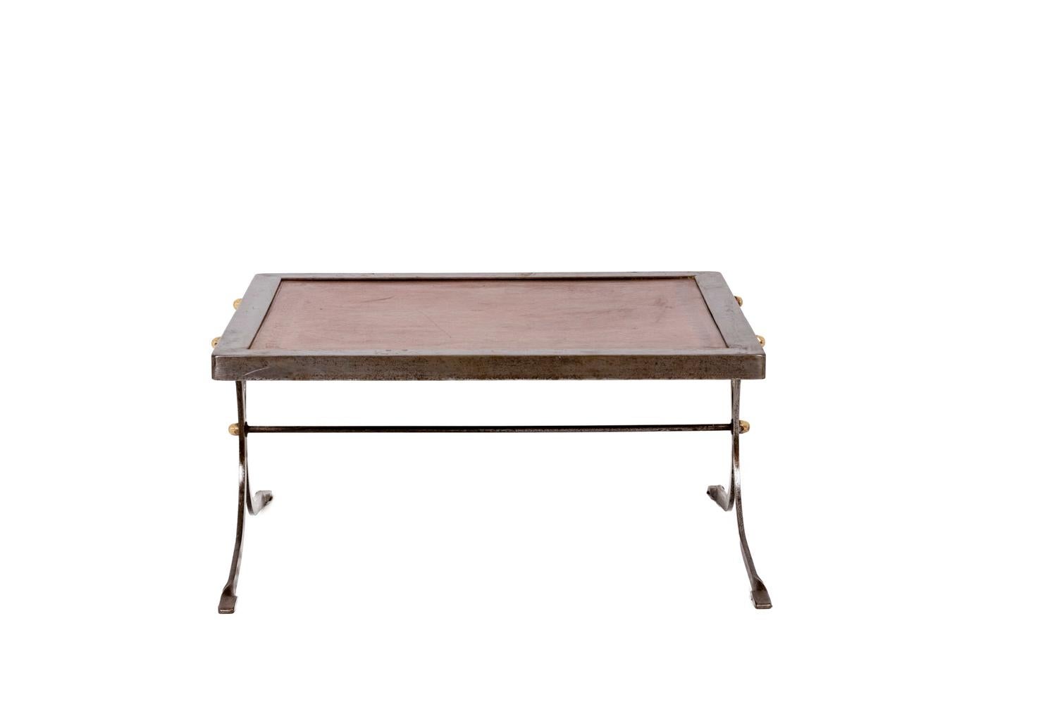 Industrial style coffee table. Iron base in silver. Orangeish leather tray, with a black patterned frieze. Assembly of the base and the top in gilded brass.

Work realized in the 1970s.

Dimensions: H 39 x W 77 x D 82 cm.

 