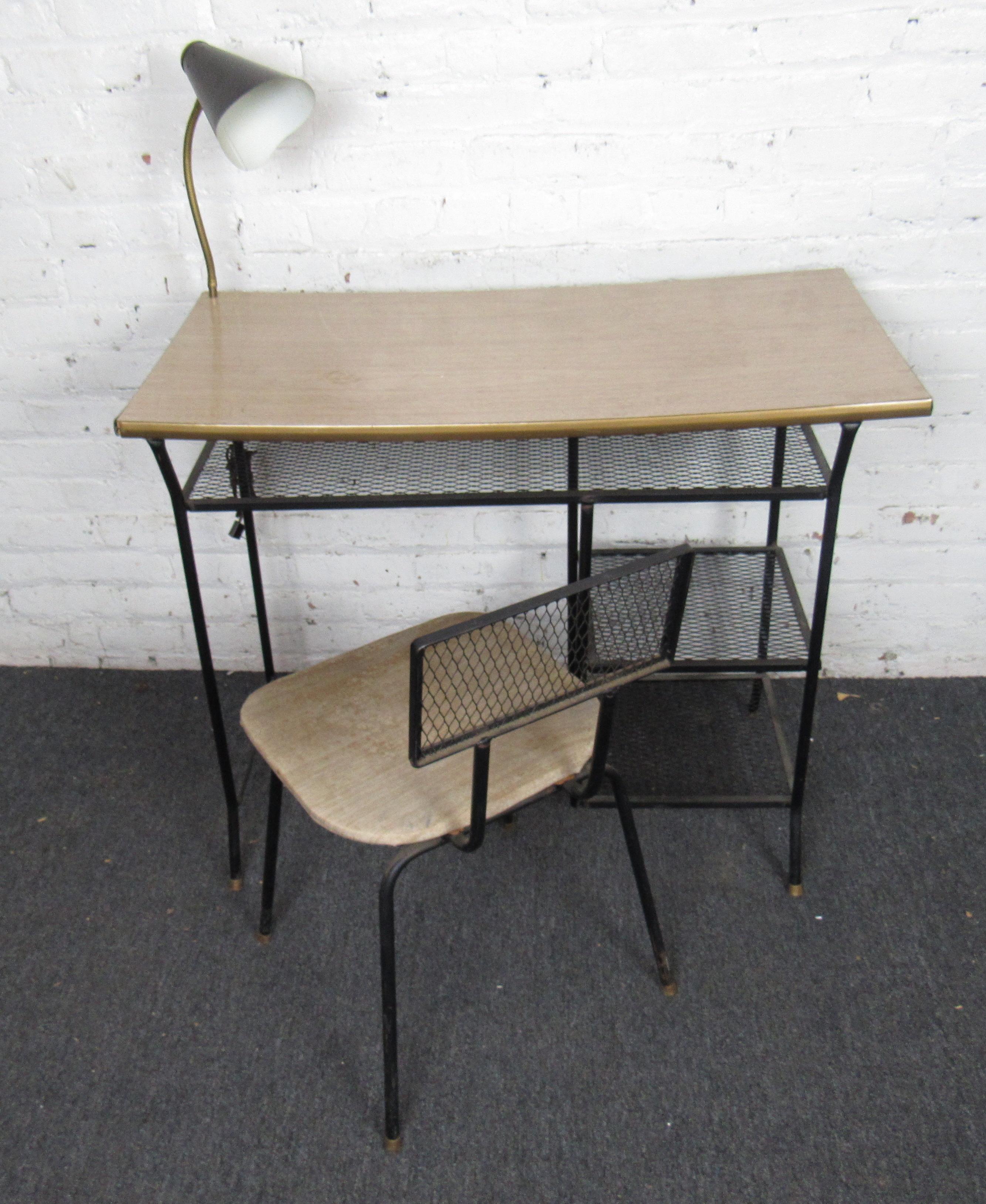 Iron frame desk and chair with linoleum style top and adjustable lamp.
Measures: Kneehole: 19 W, 24 H

(Please confirm item location - NY or NJ - with dealer).
 