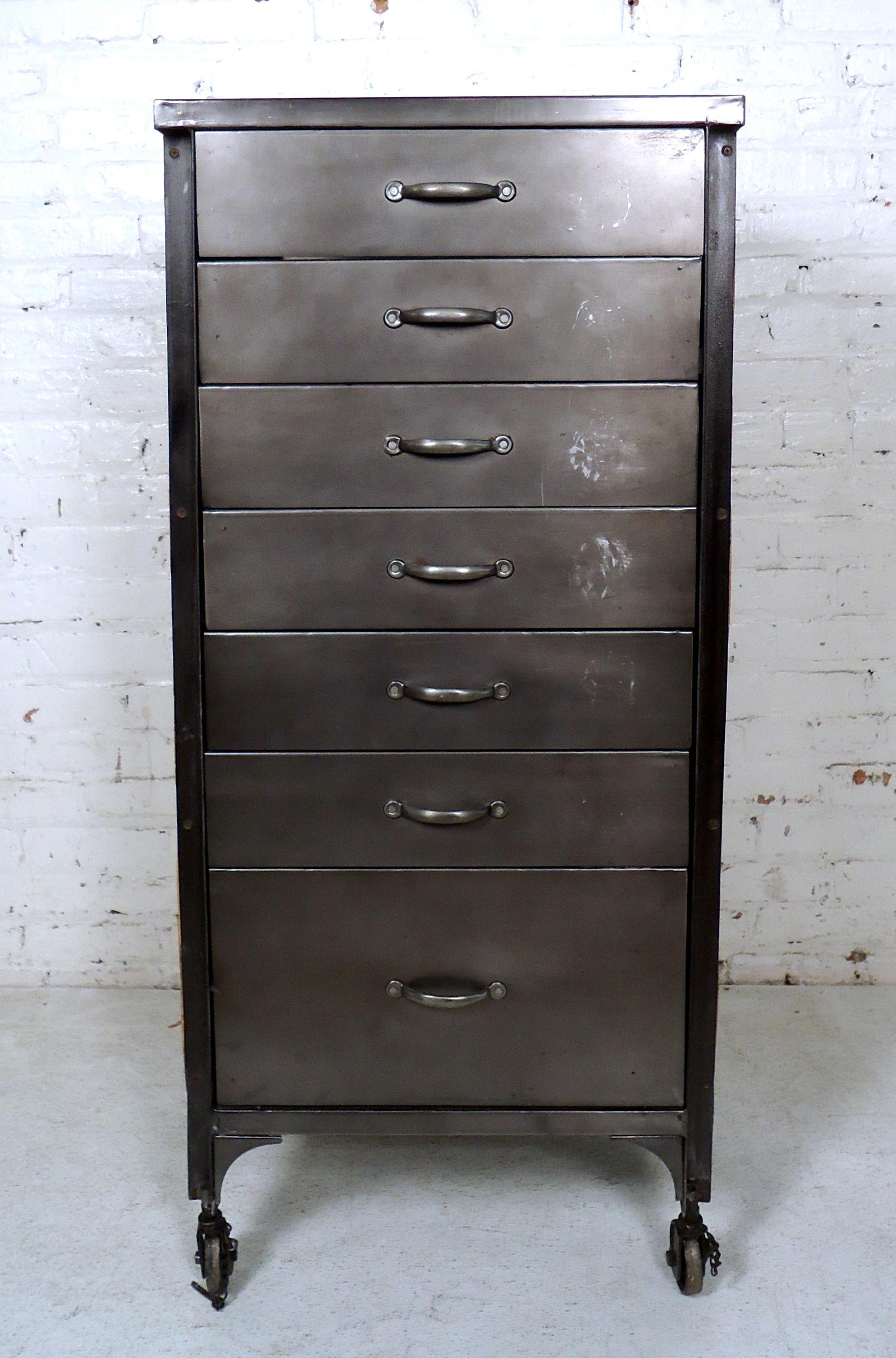 Vintage style cabinet made of reclaimed wood and metal with seven drawers for storage. Small casters add to the Machine Age style.

(Please confirm item location - NY or NJ - with dealer).
   