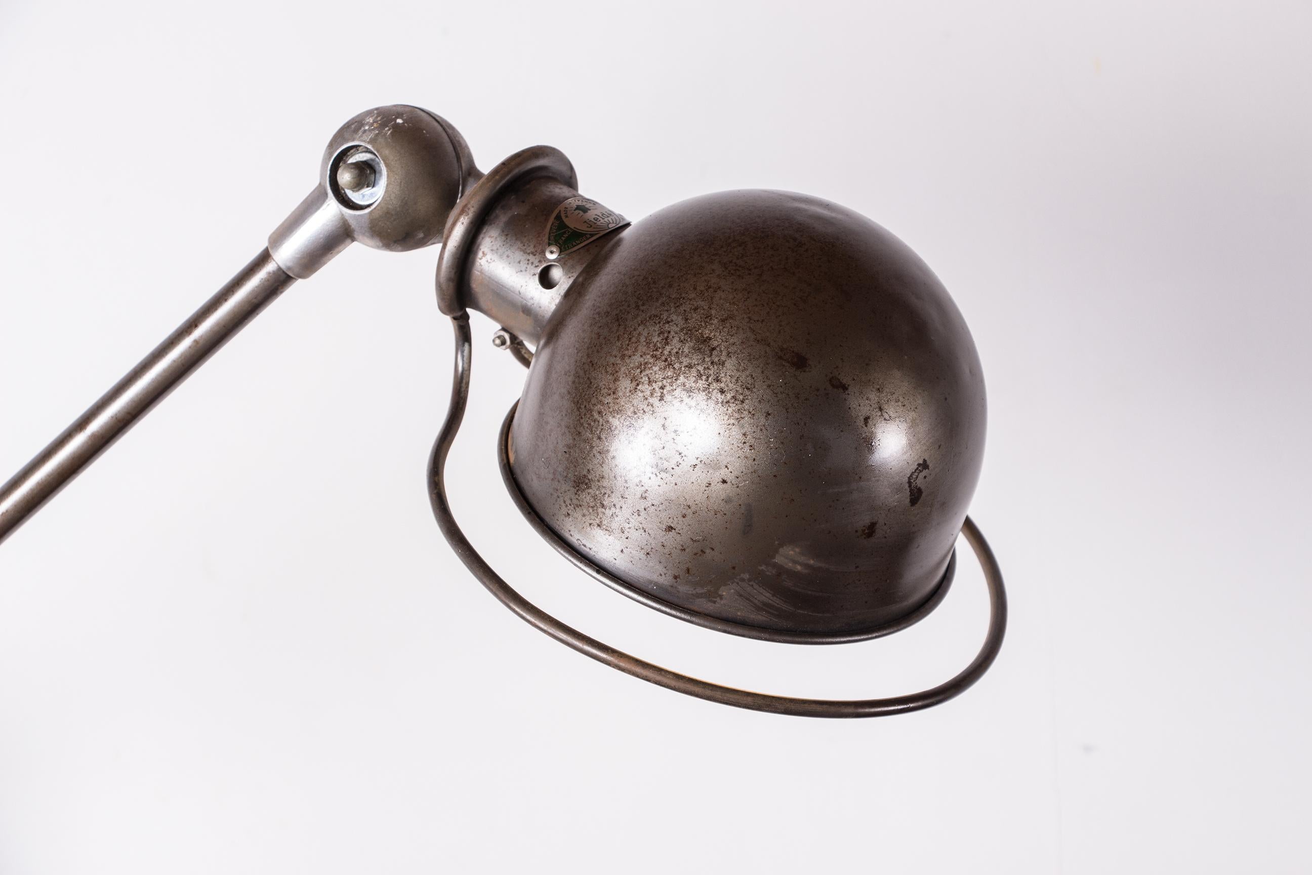 French Industrial style metal desk lamp with two articulated arms by Jean-Louis Domecq  For Sale