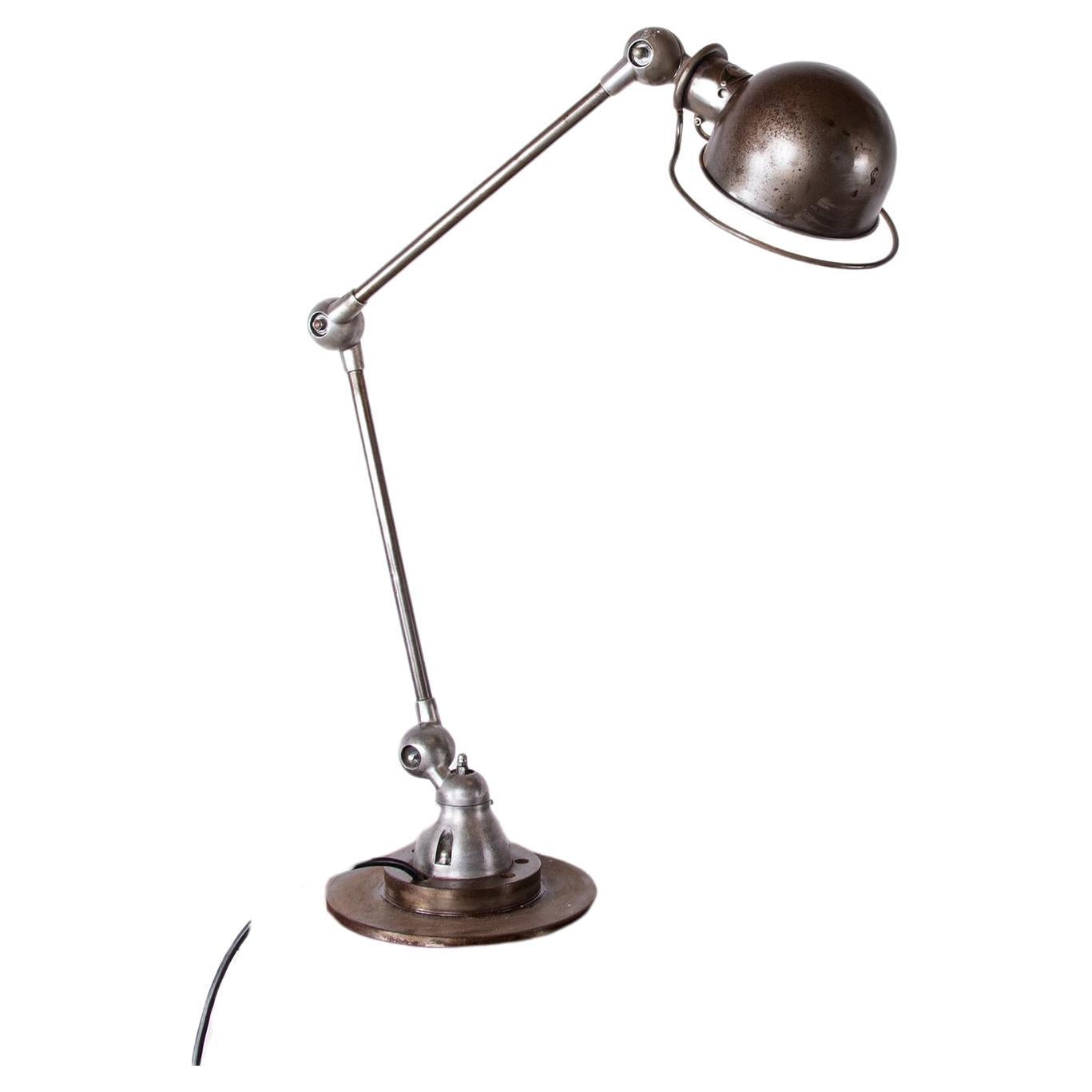 Industrial style metal desk lamp with two articulated arms by Jean-Louis Domecq  For Sale