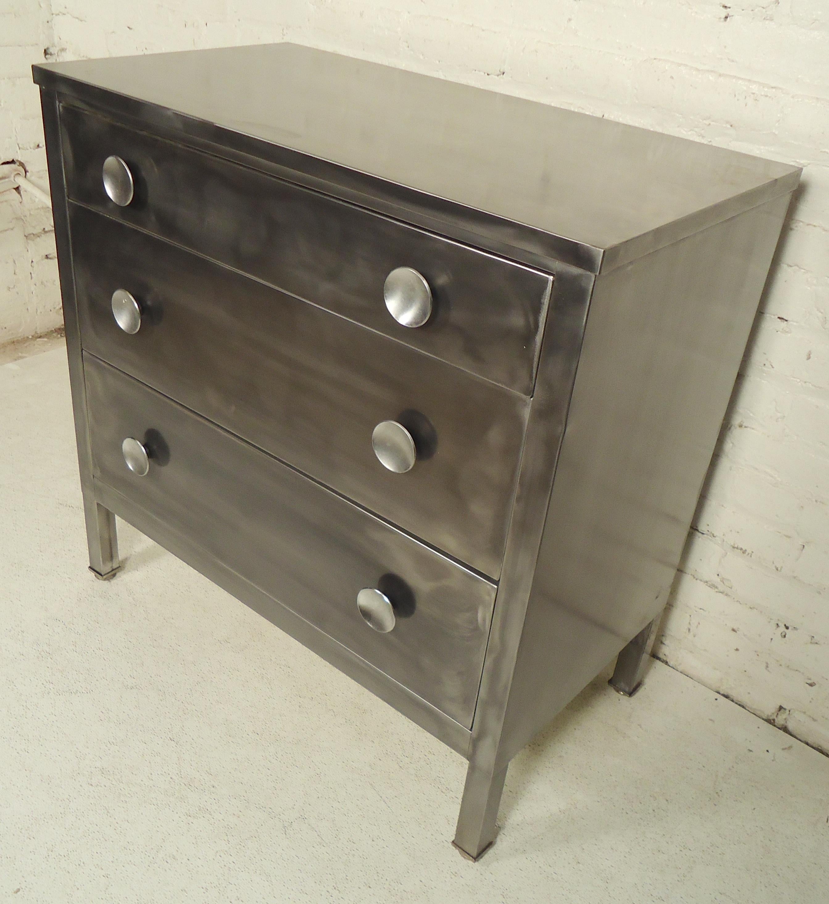 Metal chest of drawers by Simmons Company. Refinished in a bare metal style.

(Please confirm item location - NY or NJ - with dealer).
   