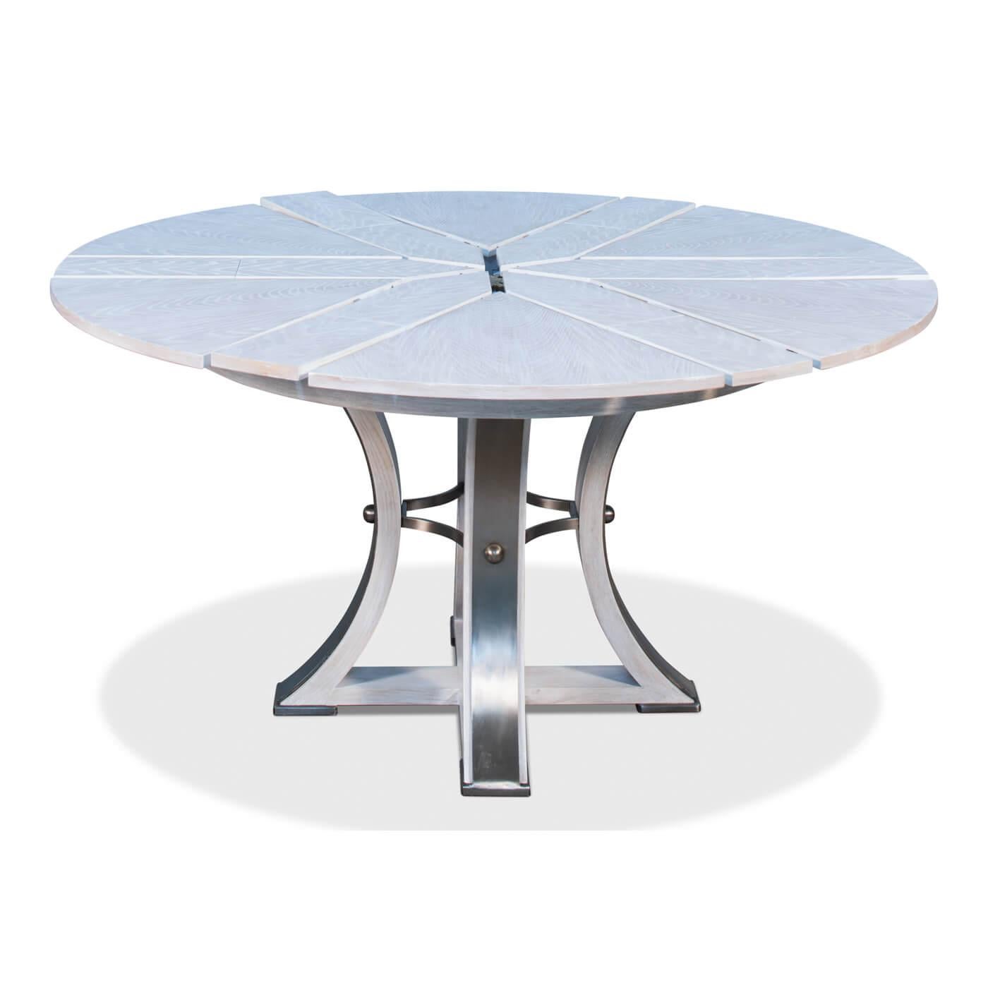 Industrial style round extension dining table with a whitewashed finish. A classic round and versatile table in a wire-brushed whitewashed oak with gunmetal accents on a modern designed geometric form base.

The table extends from 45