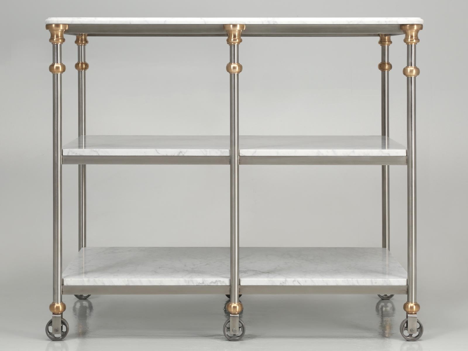 Industrial style stainless and bronze kitchen island with Carrara marble shelves;
Our latest old plank kitchen island is fabricated from stainless steel, solid bronze couplings and features three shelves cut from a single slab of imported Italian