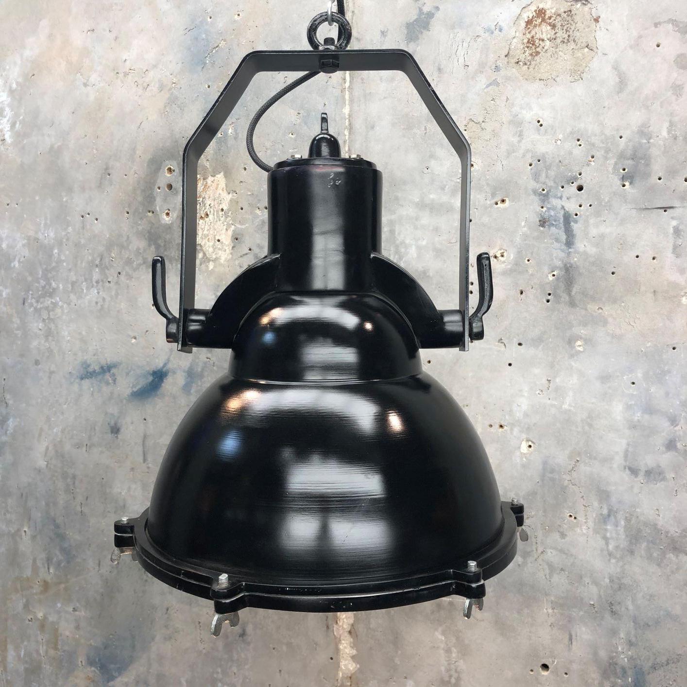An industrial style black cargo ceiling pendant light. 

Reclaimed from military ships and professionally restored by Loomlight in UK ready for modern interiors. 

The dome is made from spun aluminium and the hanging frame is cast aluminium. It