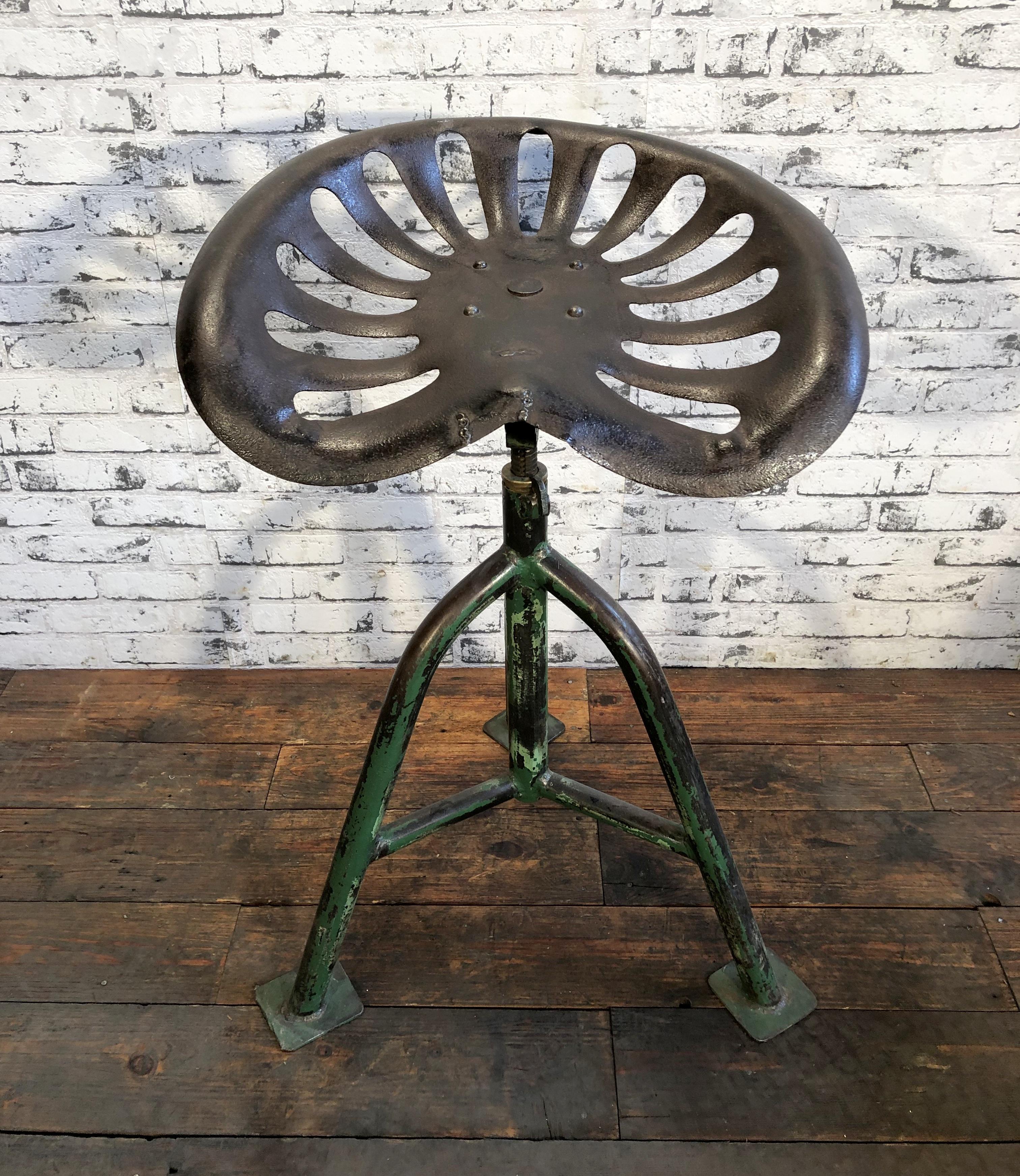 Vintage industrial height adjustable swivel chair from 1950s. Old tractor seat on iron construction.
Dimensions of the seat: 45 x 40 cm.
Seat height: min. 60 - max. 70 cm.