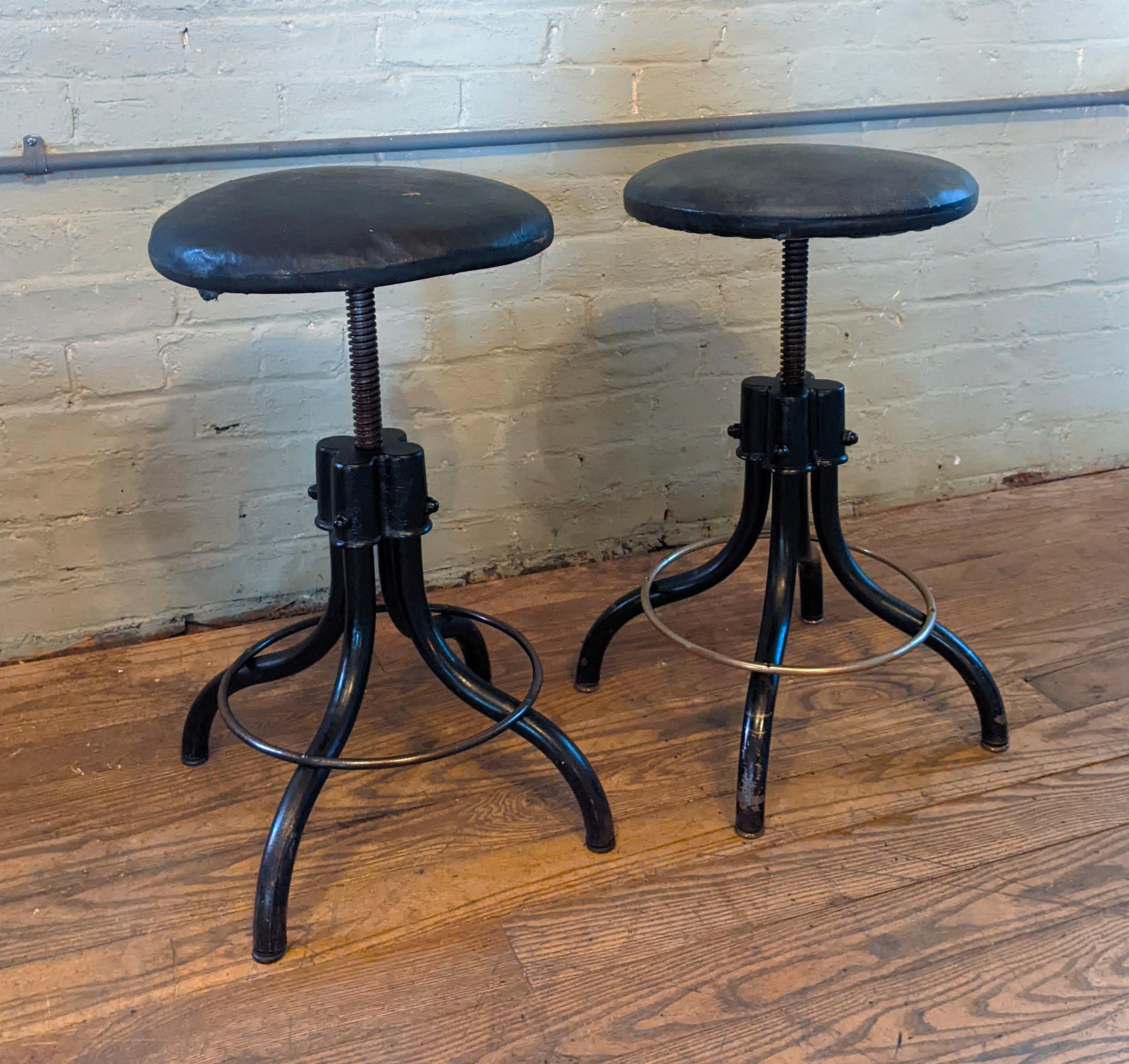 Pair of black adjustable swivel stools

Overall Dimensions: 13 1/4